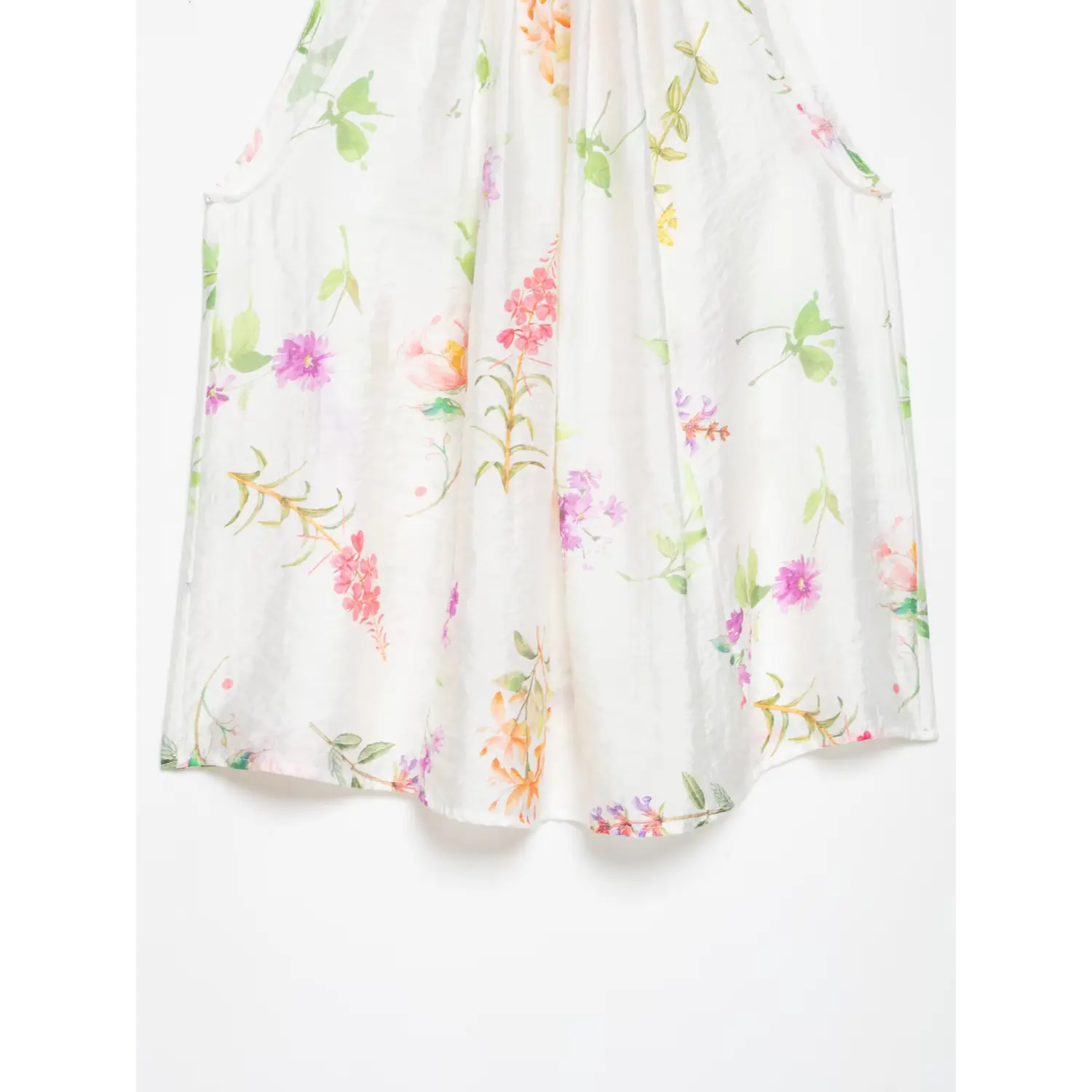 Back lower body flat view, loose trapeze cut fabric, scattered mixed watercolor flower print, lightweight wrinkled texture