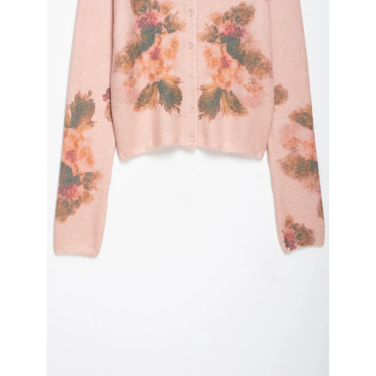 Close-up of ribbed hem and long sleeves with watercolor floral print
