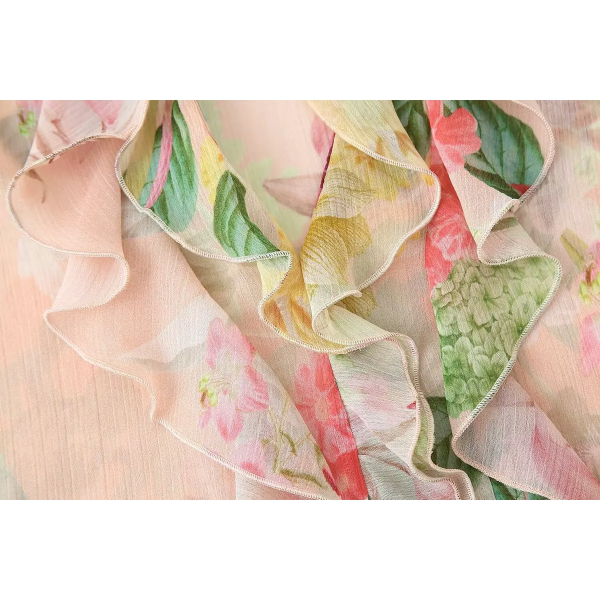 Close-up of wavy ruffle placket and floral print