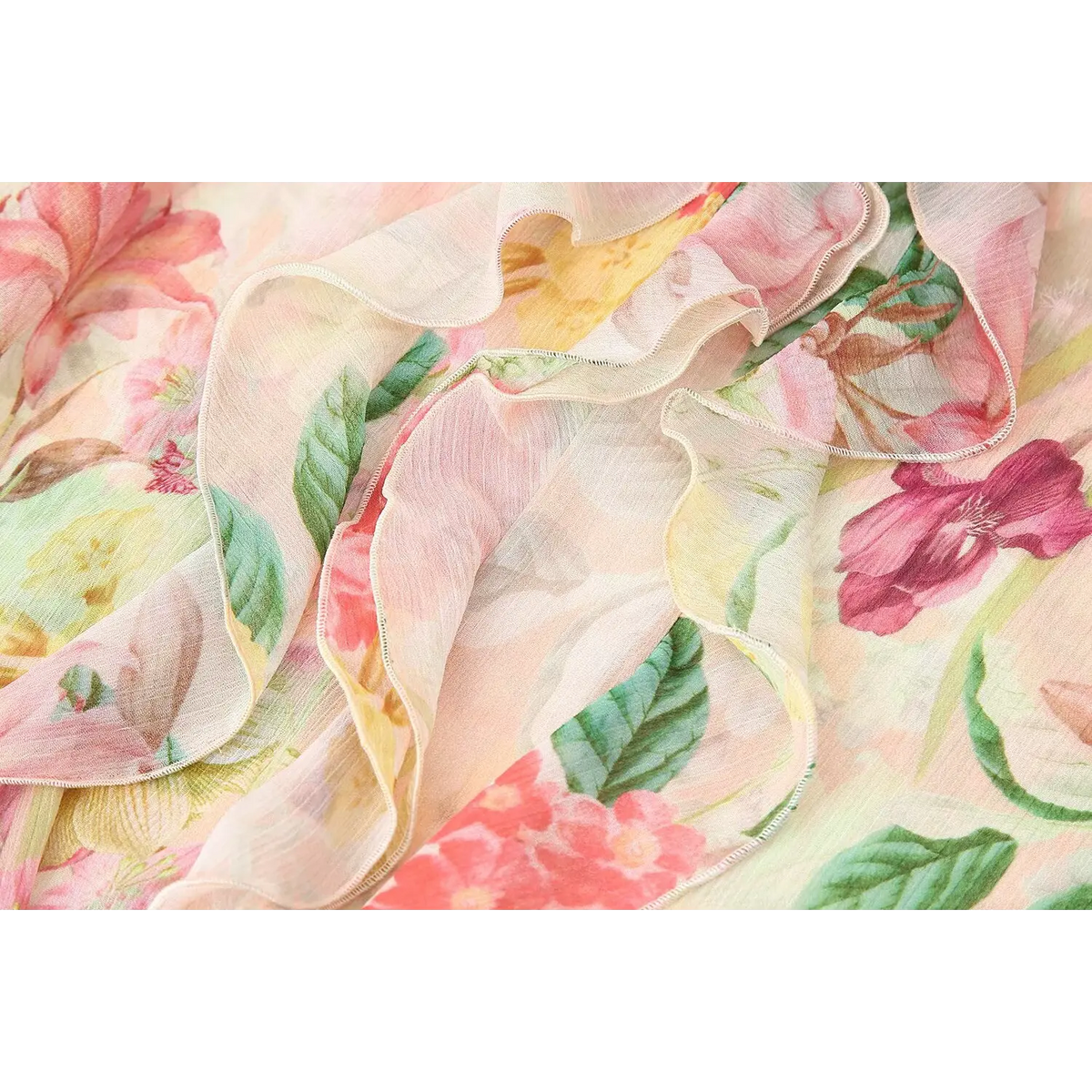 Close-up of ruffled trim and watercolor floral print