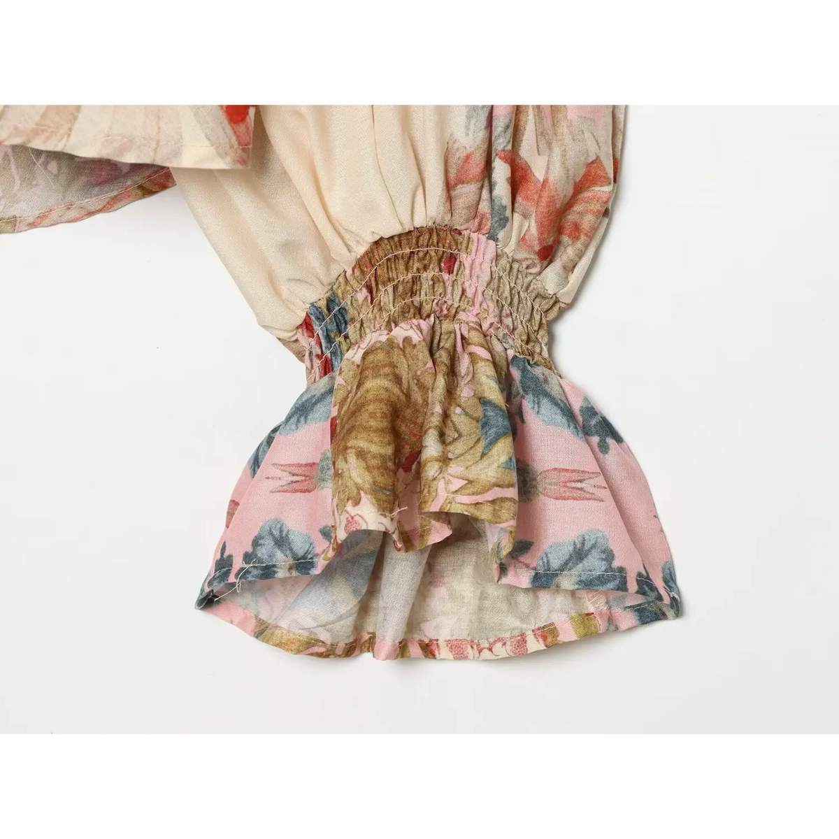 Close-up of smocked ruffle cuff