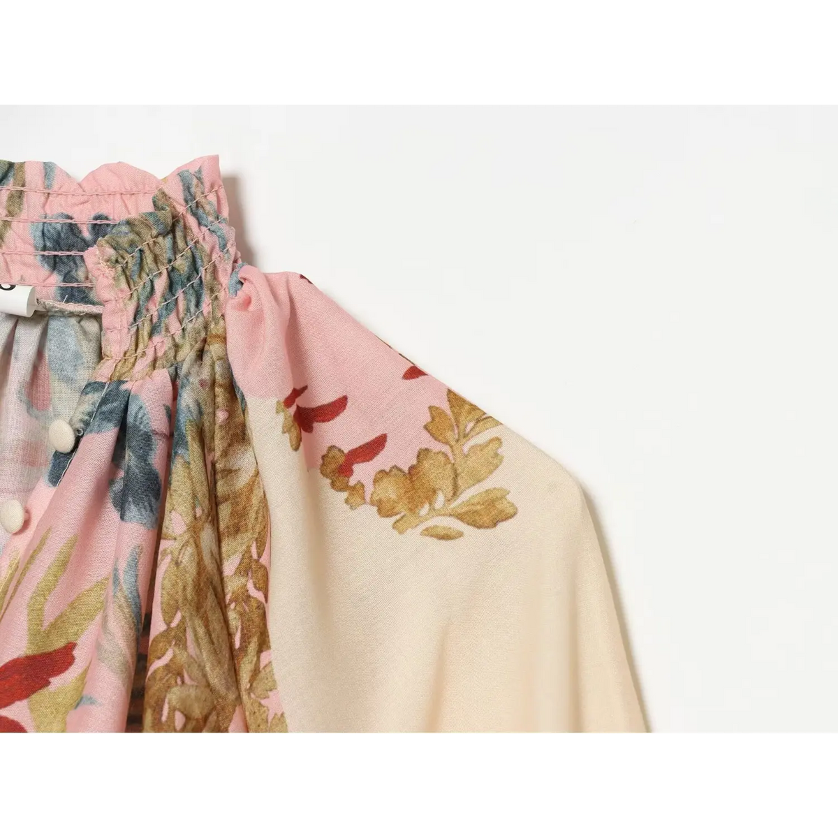 Close-up of gathered shoulder and botanical print