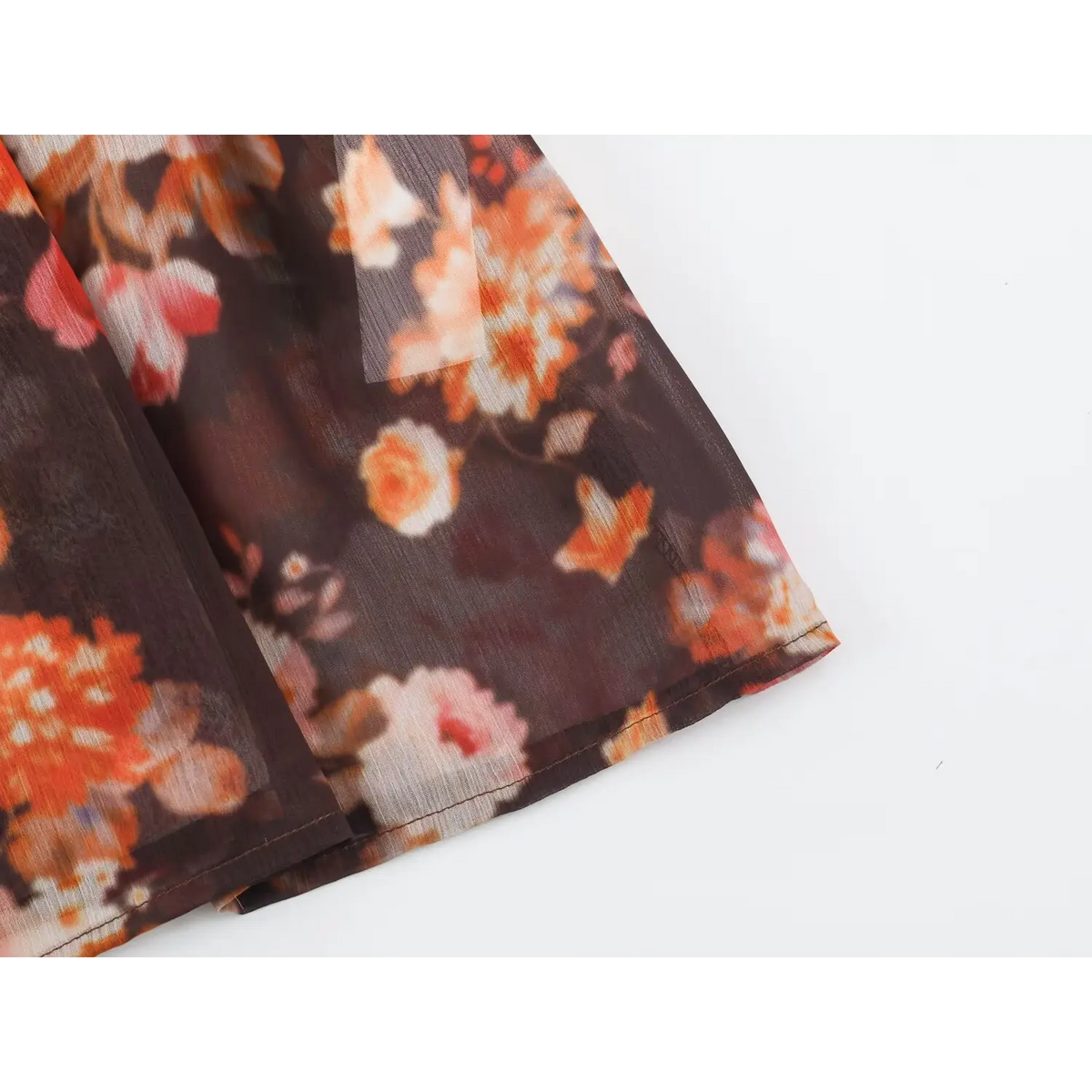 Close-up of sheer hem edge and floral print