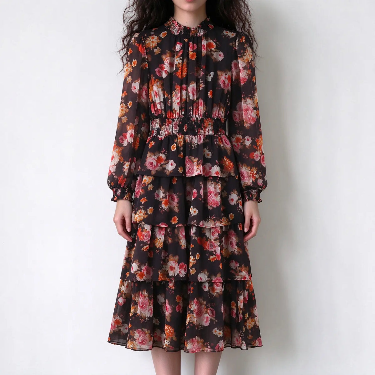 Model wearing watercolor floral smocked tiered midi dress, front view