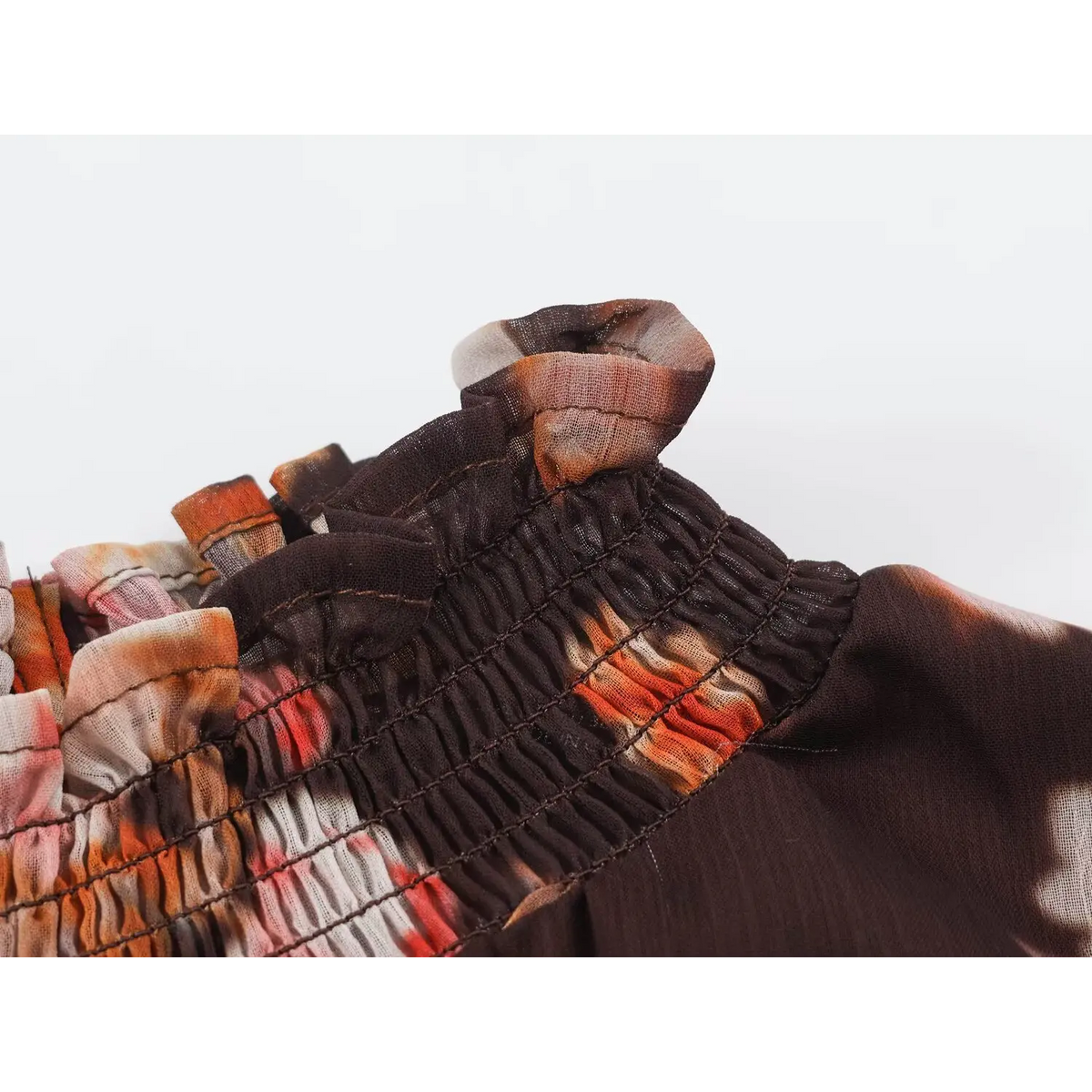 Close-up of ruffled high neck smocking detail