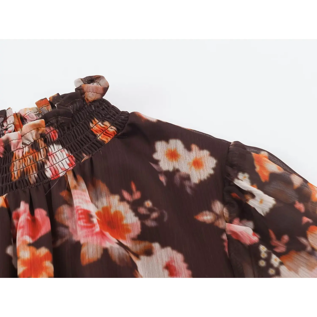 Close-up of ruffled neckline and shoulder gather