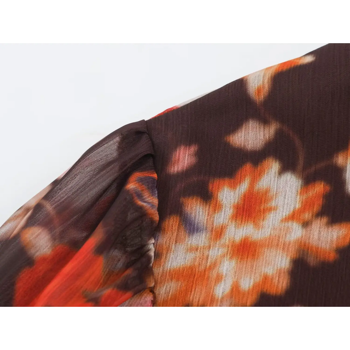 Close-up of puff sleeve seam and floral print fabric