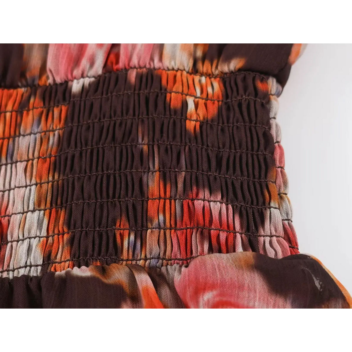 Close-up of smocked elastic waist detail