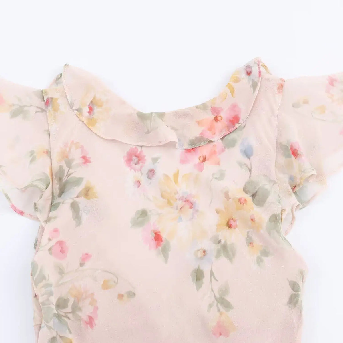 Close-up of back neckline ruffle trim