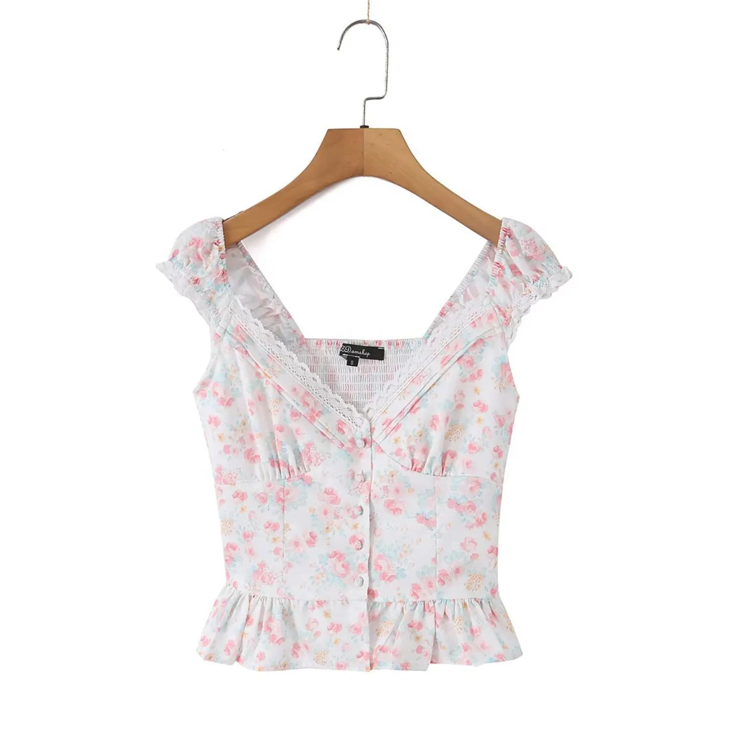 Wood hanger front shot romantic cropped cami top, elastic ruffle cap sleeves with white lace trim, deep V neck hollow lace splicing, vertical fabric button detail, slim fit peplum ruffle hem, lightweight woven fabric with soft mixed pink blue yellow flower print