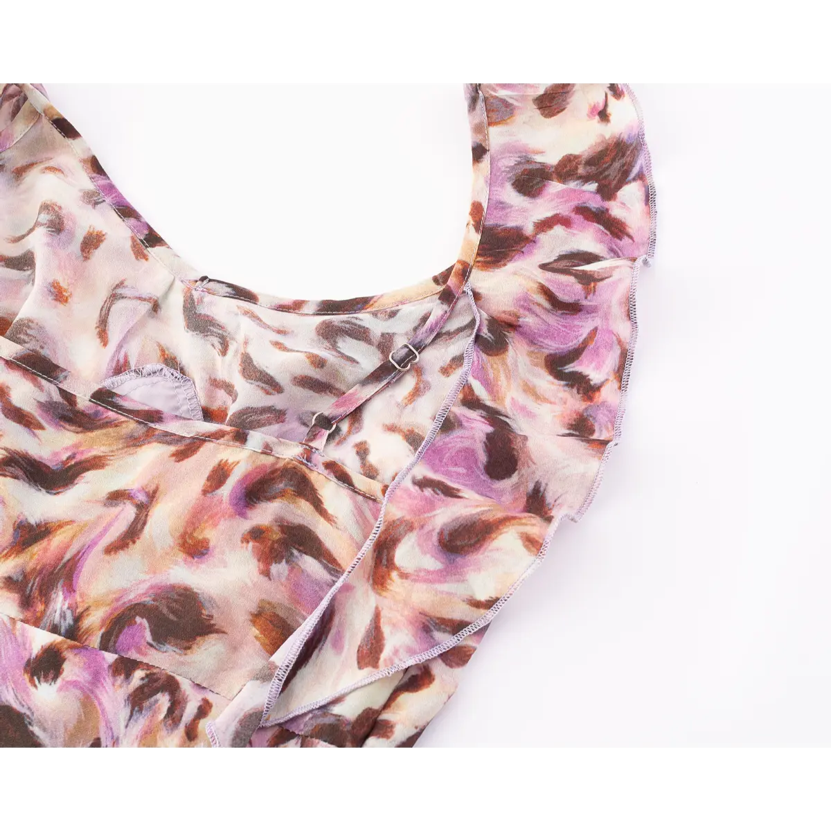 Close-up of the adjustable spaghetti straps and V-neckline, showing the ruffled trim and metal sliders.