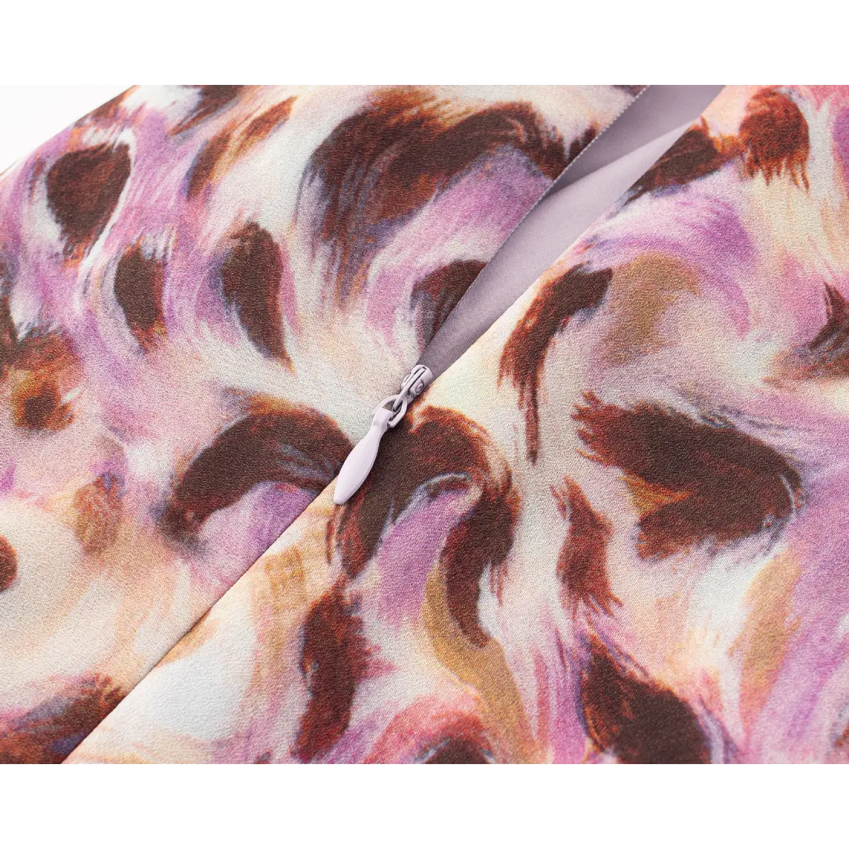 Close-up of the side-seam zipper with a matching fabric pull tab.