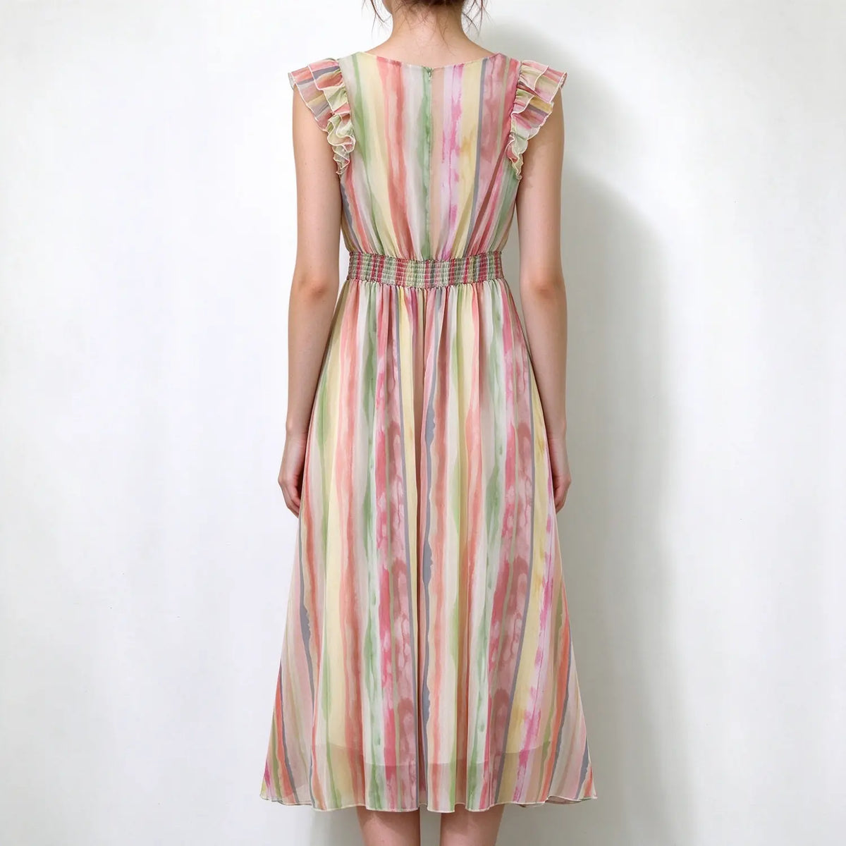 Model back view, watercolor stripe chiffon maxi dress, ruffle shoulder sleeves, center back zipper, smocked waist, lightweight flowy mixi dress
