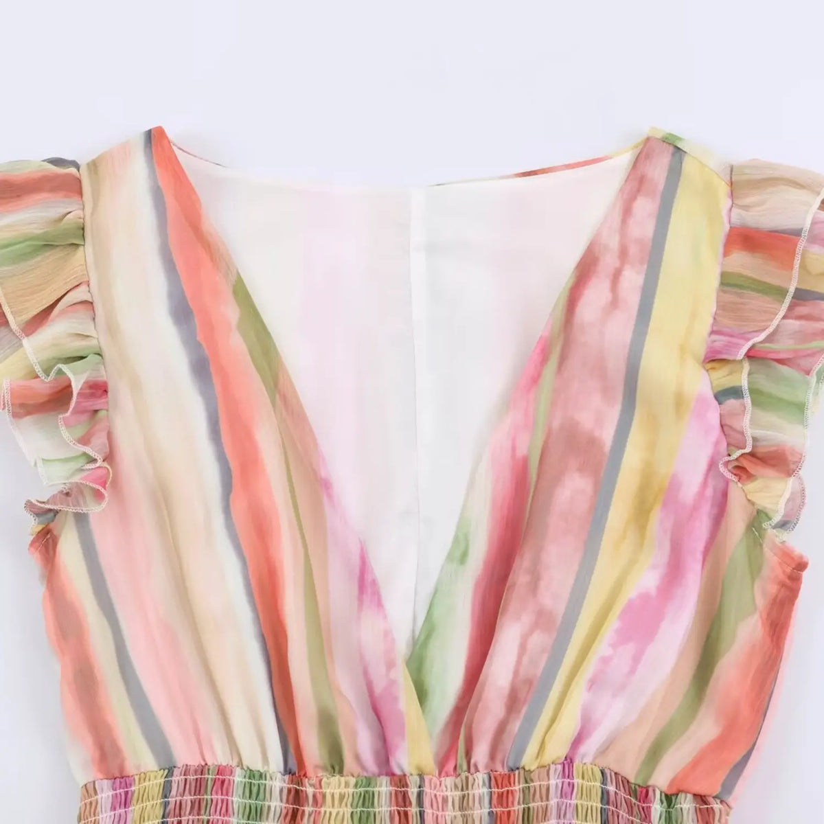 Close-up of V neck and ruffle sleeve