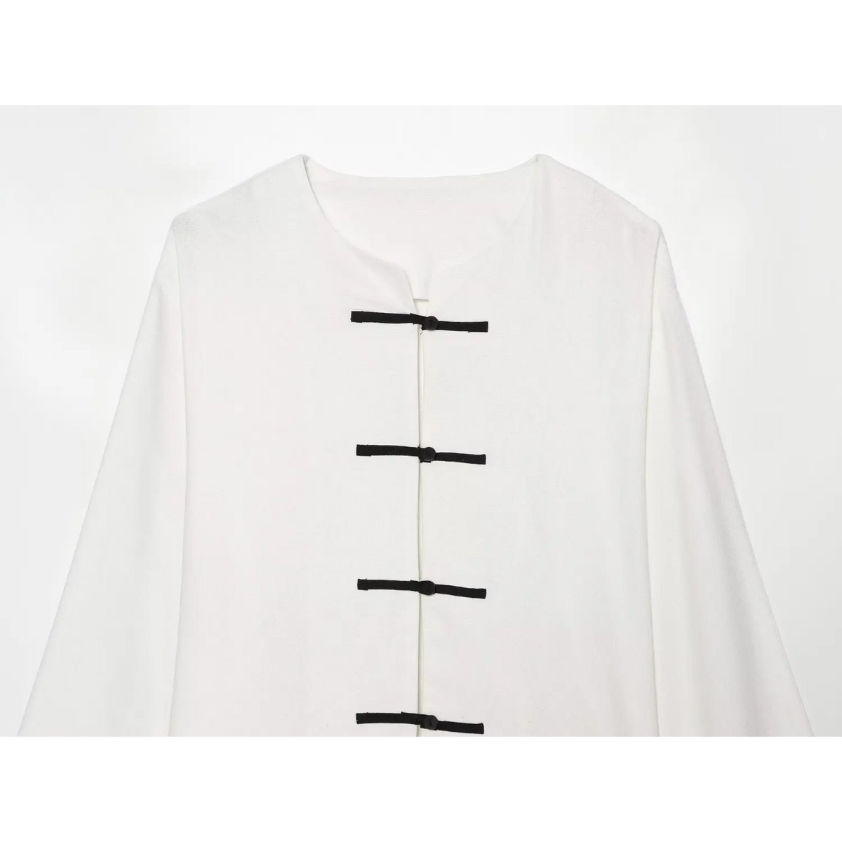 Close-up of round neck and black frog buttons