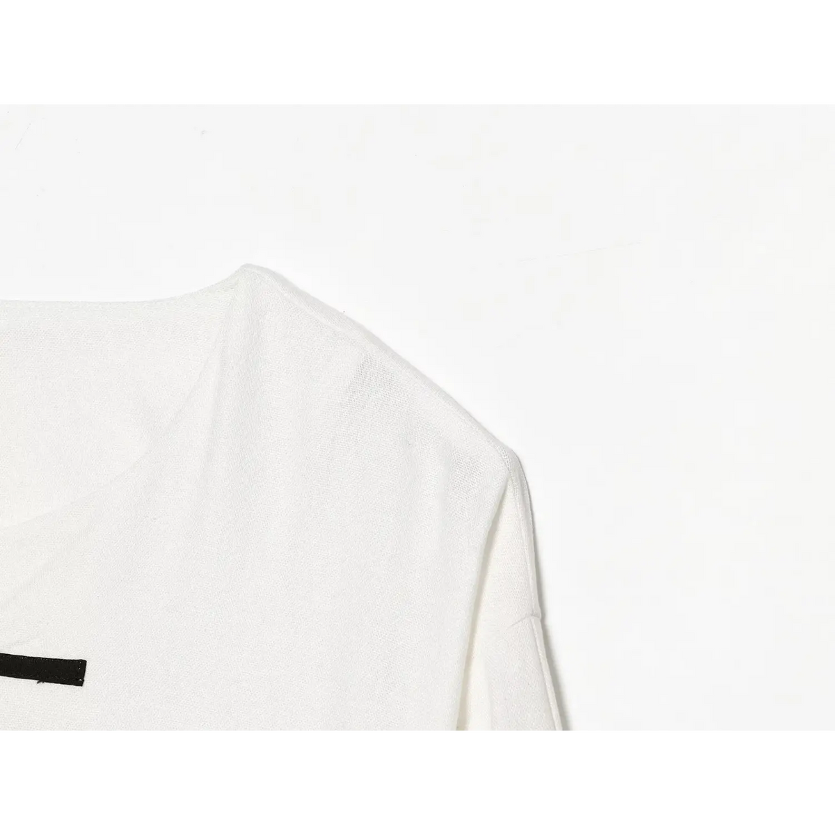 Close-up of drop shoulder seam and neckline