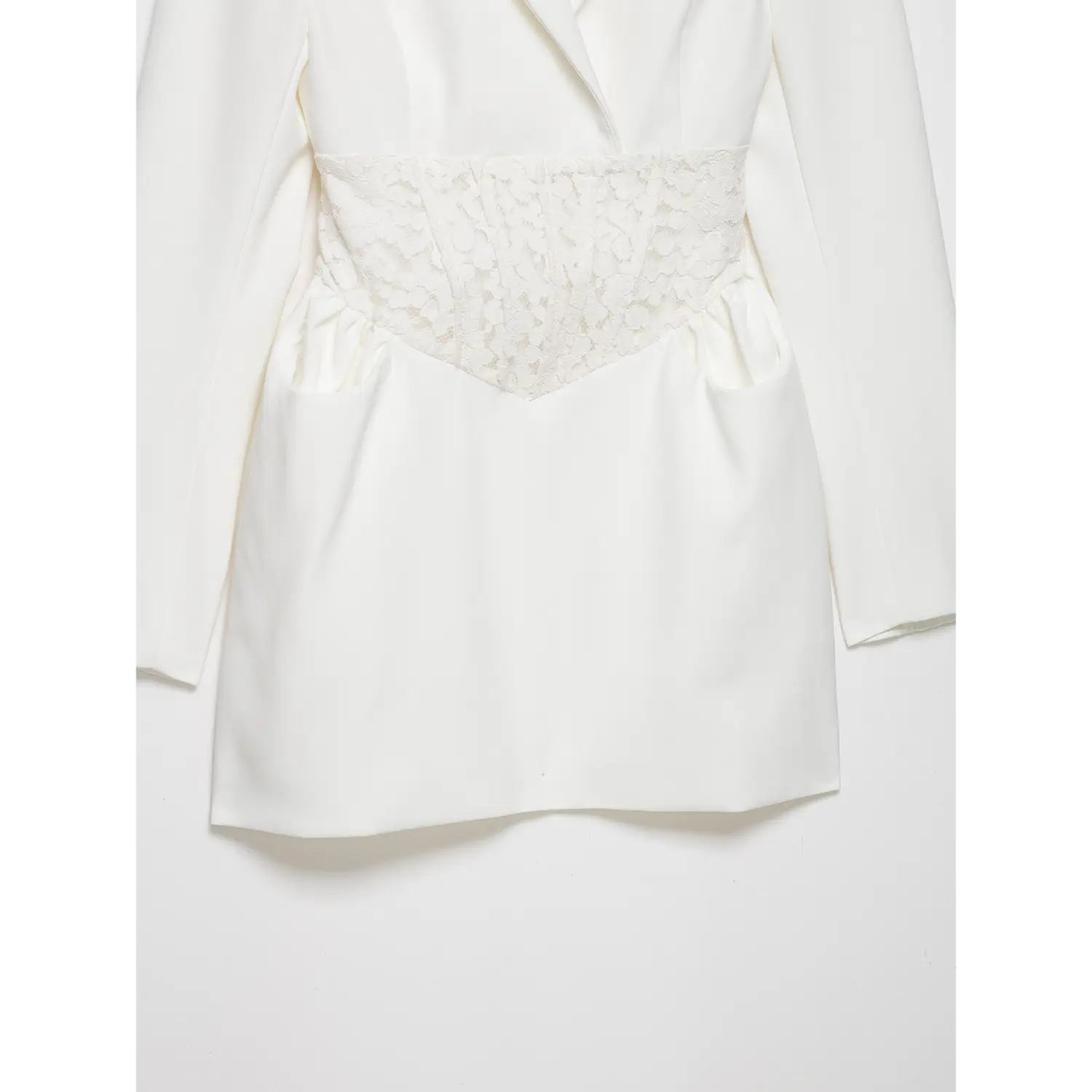 Full front view white long sleeve blazer mini dress, notched lapel, floral lace corset waist and side pockets