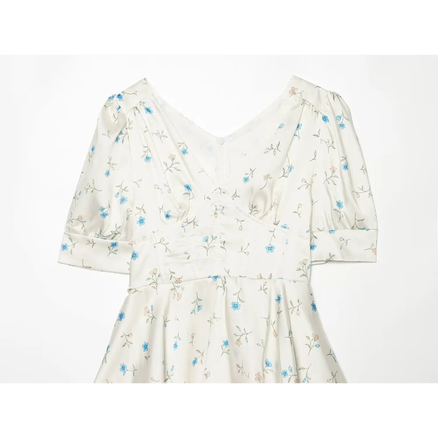 Close-up of women's floral dress V neckline and corset structured waist, puff short sleeves, white base with blue flower print