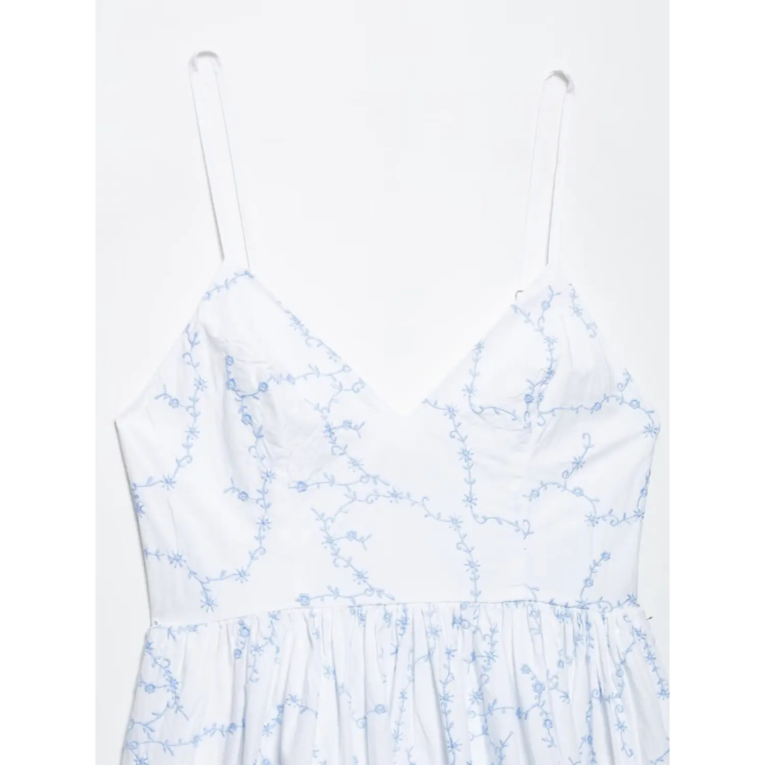 V-neck & thin adjustable spaghetti straps closeup white blue floral embroidery mini dress