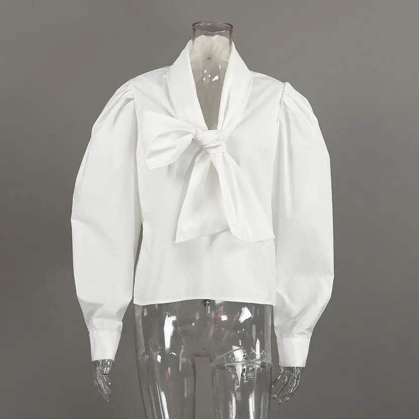 White bow neck puff sleeve cropped blouse on mannequin, front view