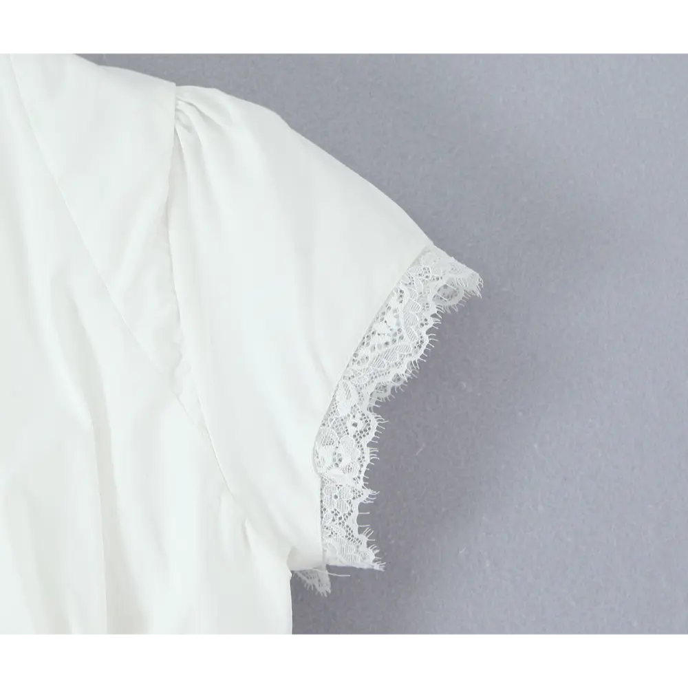 Close-up of puff sleeve with eyelash lace trim