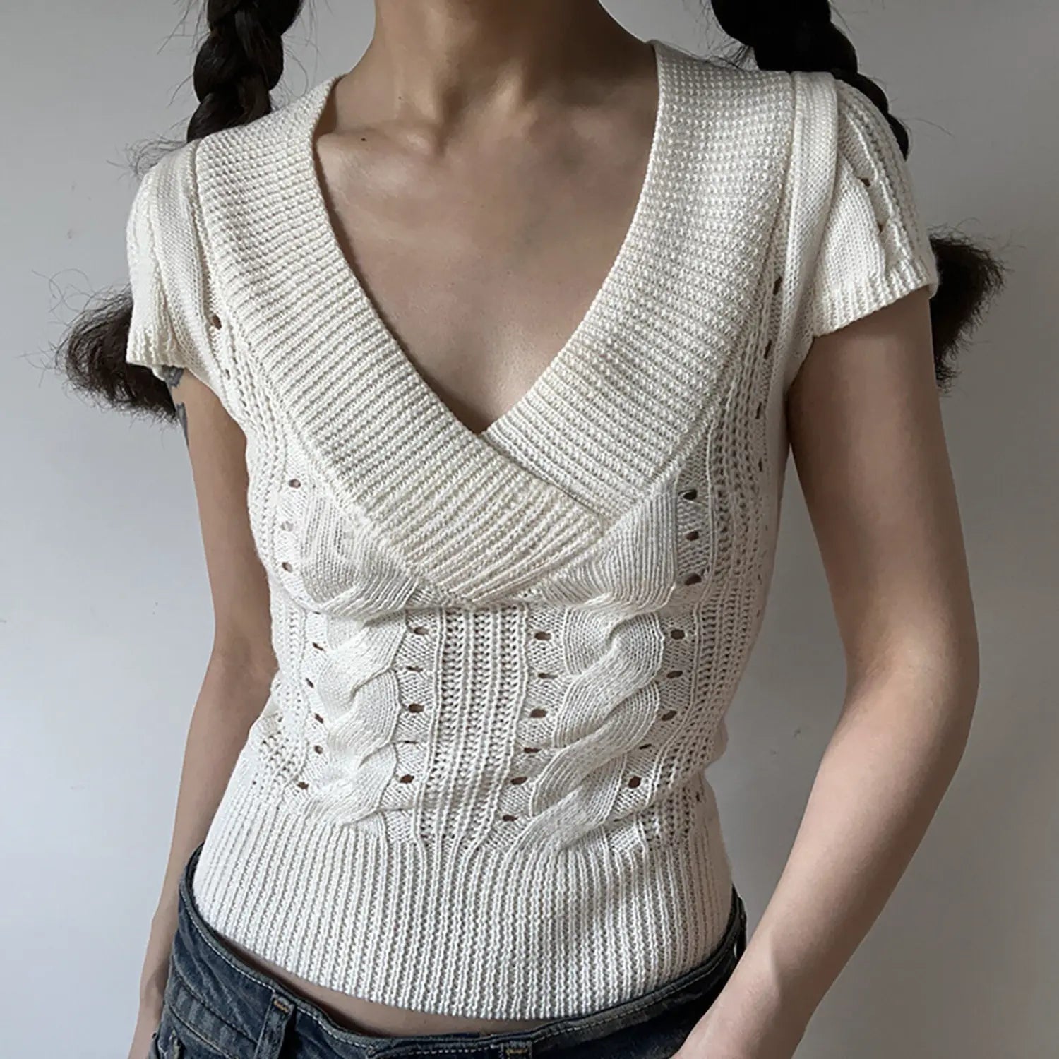 White cable twist knit short sleeve cropped top, deep v neck slim fit ribbed hem women casual knit tee front angle view