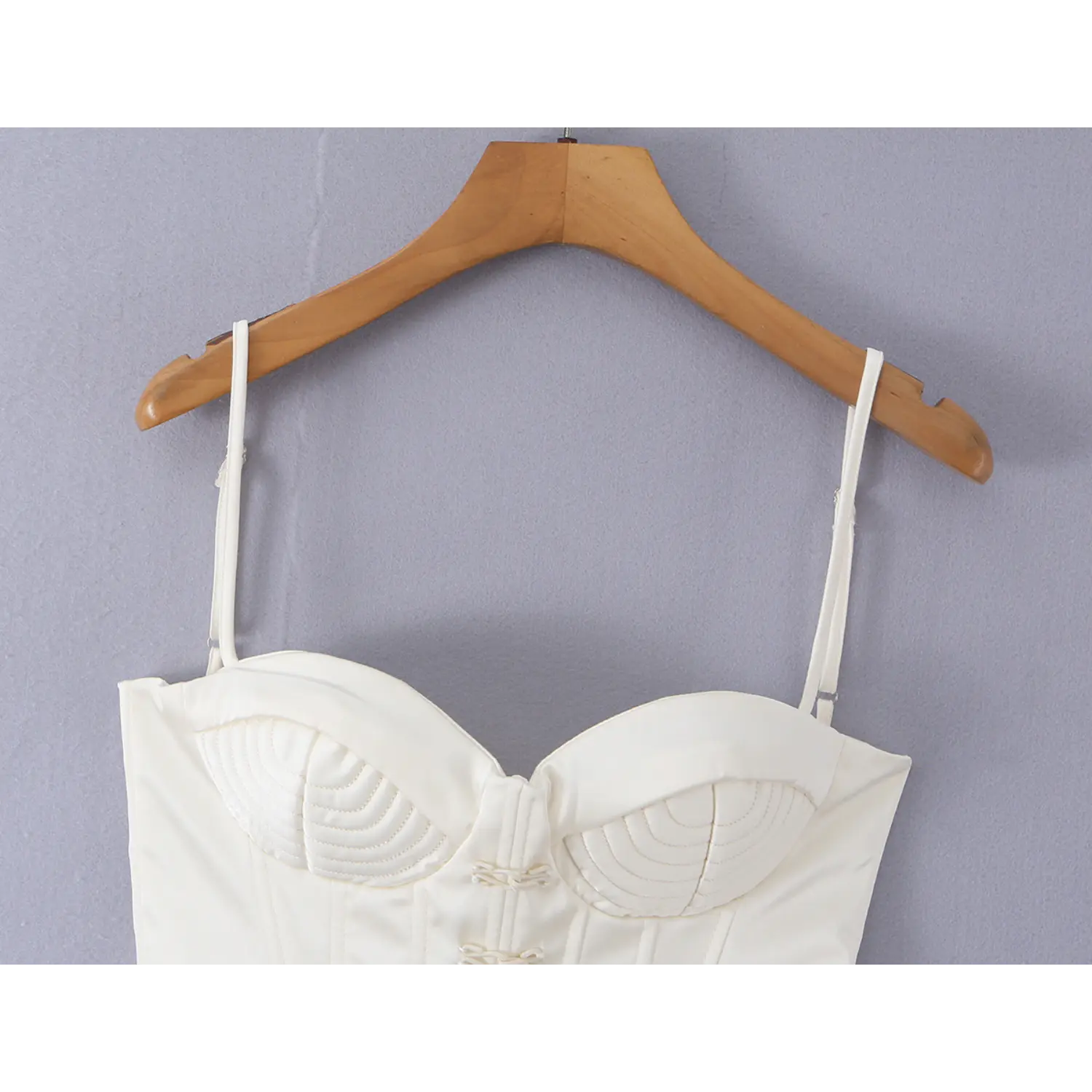 Front view of white satin corset cami top, quilted sweetheart cups, traditional Chinese knot fasteners, structured boning waist shaping