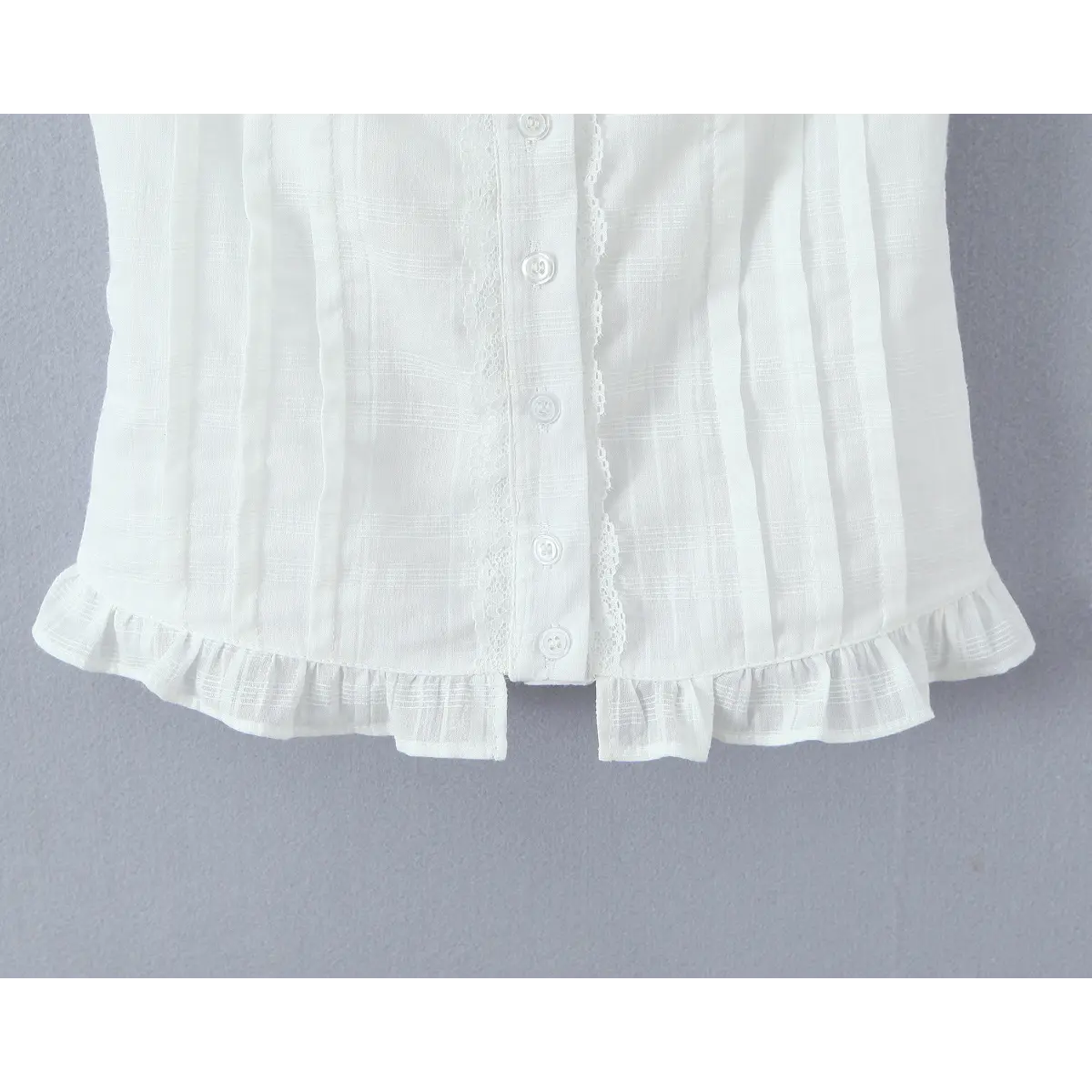 Close-up of the ruffled hem at the bottom of the top.