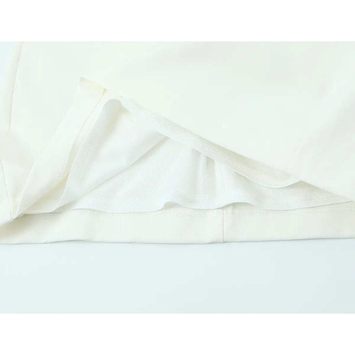 Close-up of the skirt lining, showing the double layer construction and neatly finished seams
