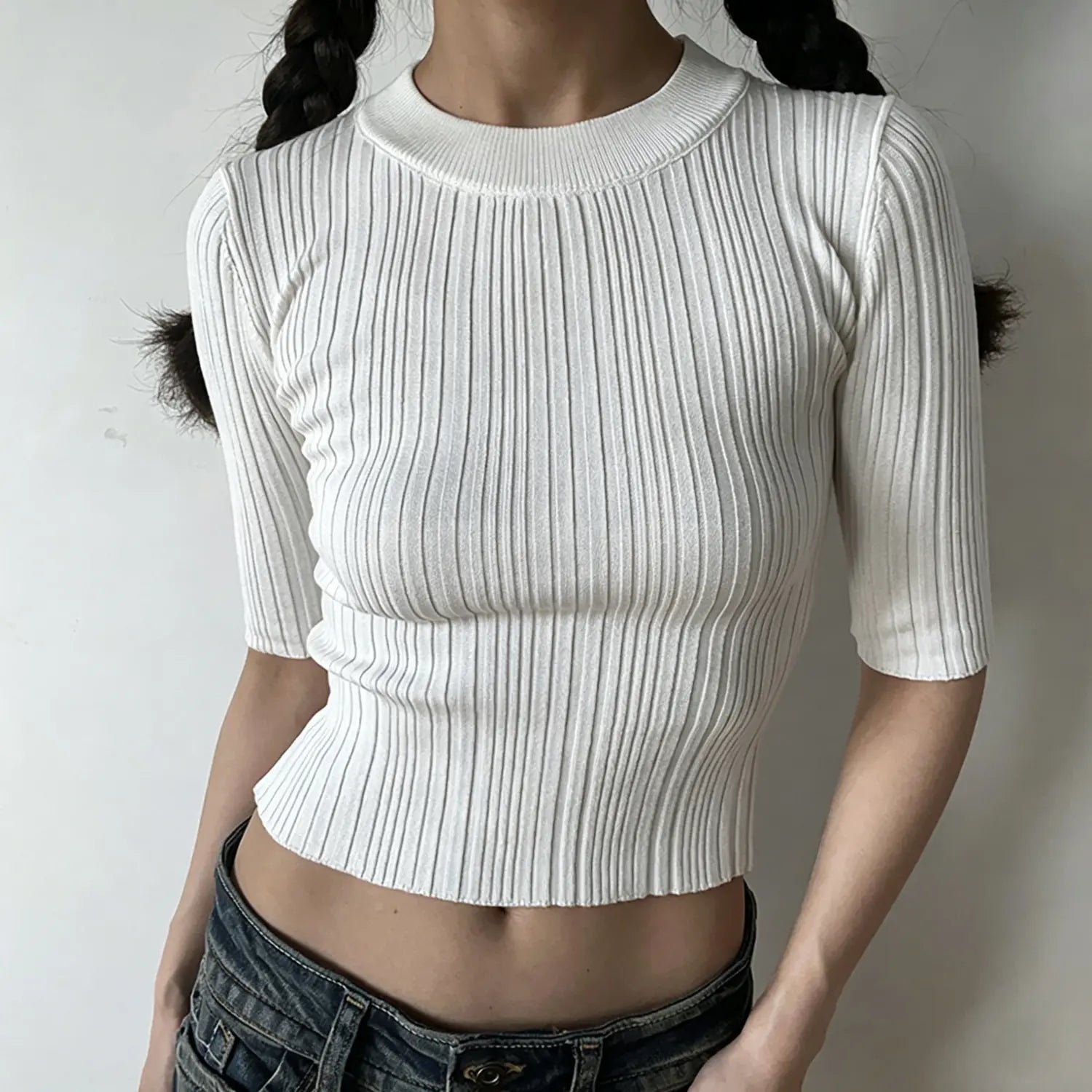 Model front view, white crew neck mid sleeve ribbed knit crop top, stretch knit cropped blouse