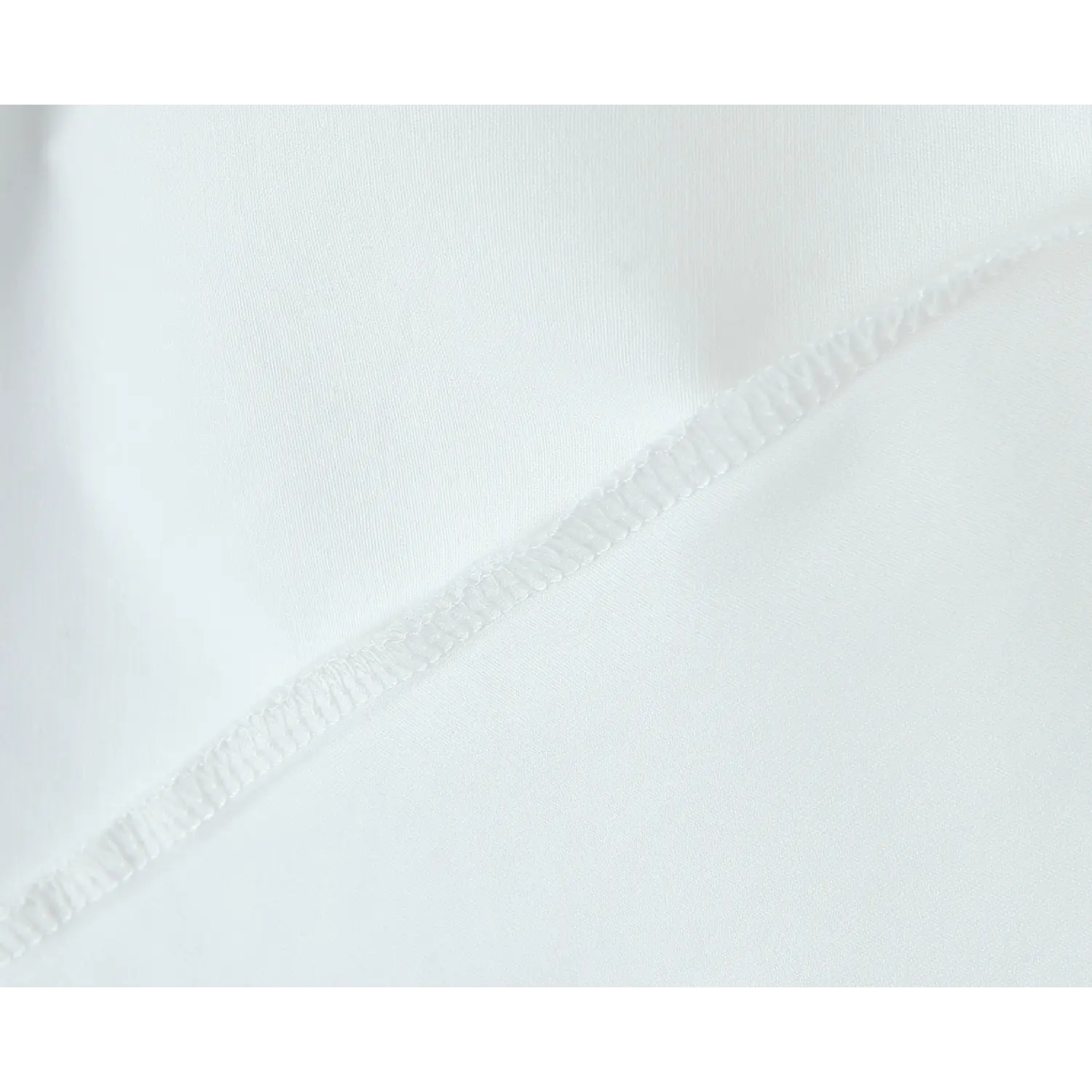 Closeup interior seam, neat overlock finishing stitch on white dress fabric
