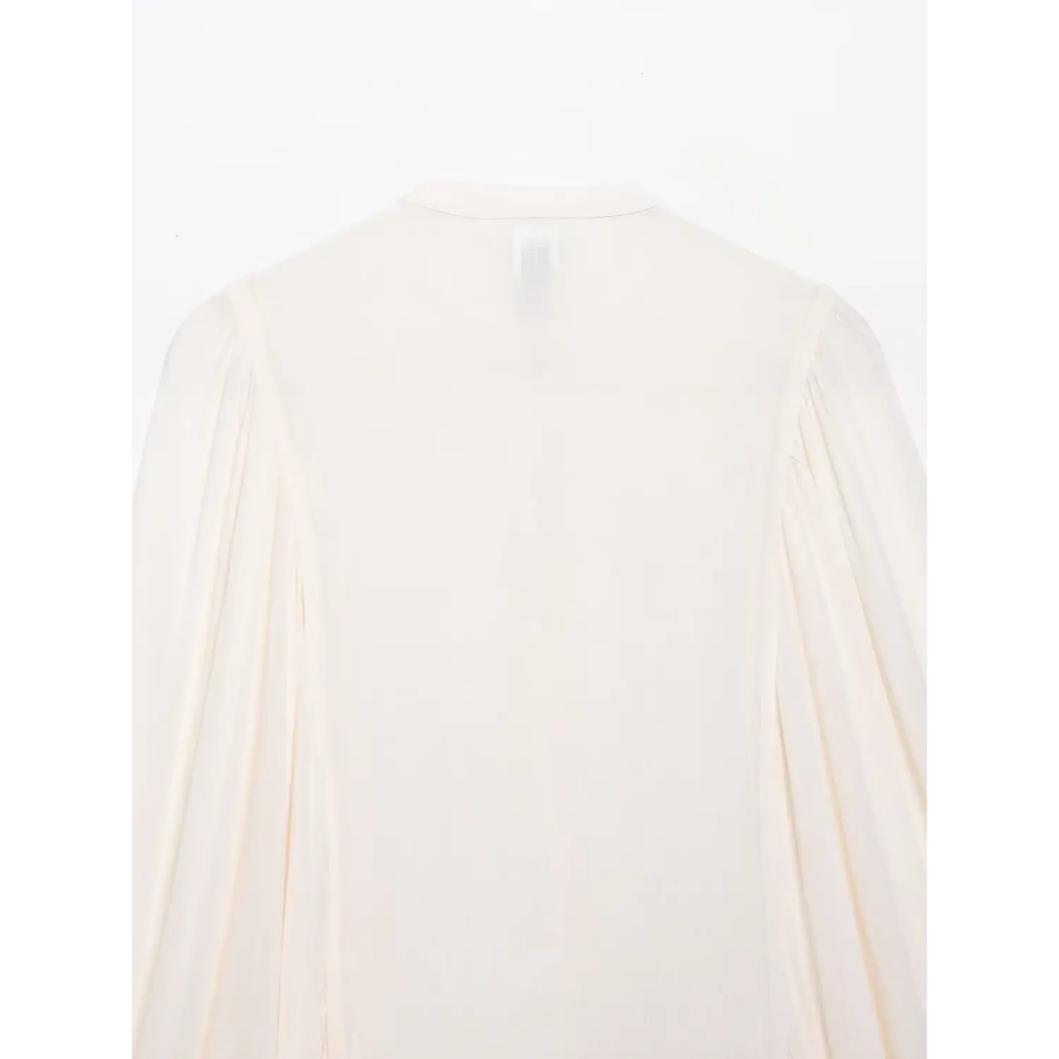 Full back view of white cropped embroidered blouse, lightweight sheer fabric, isolated white background