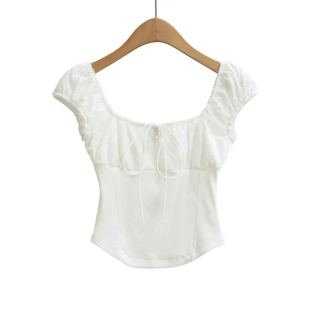 Full front view of white embroidered ribbed top with square neckline, puff sleeves and drawstring detail.
