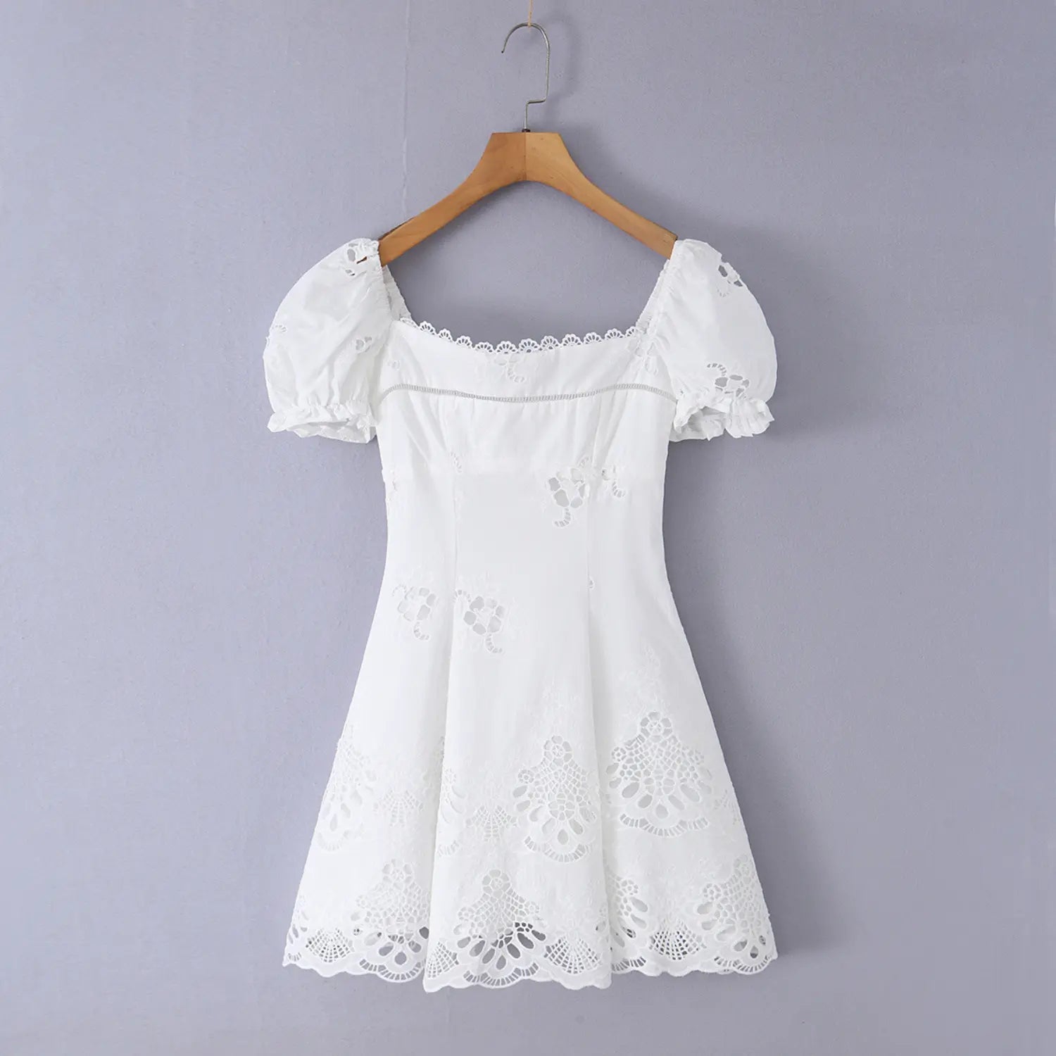  Full front view on white background of the white square-neck puff-sleeve eyelet dress