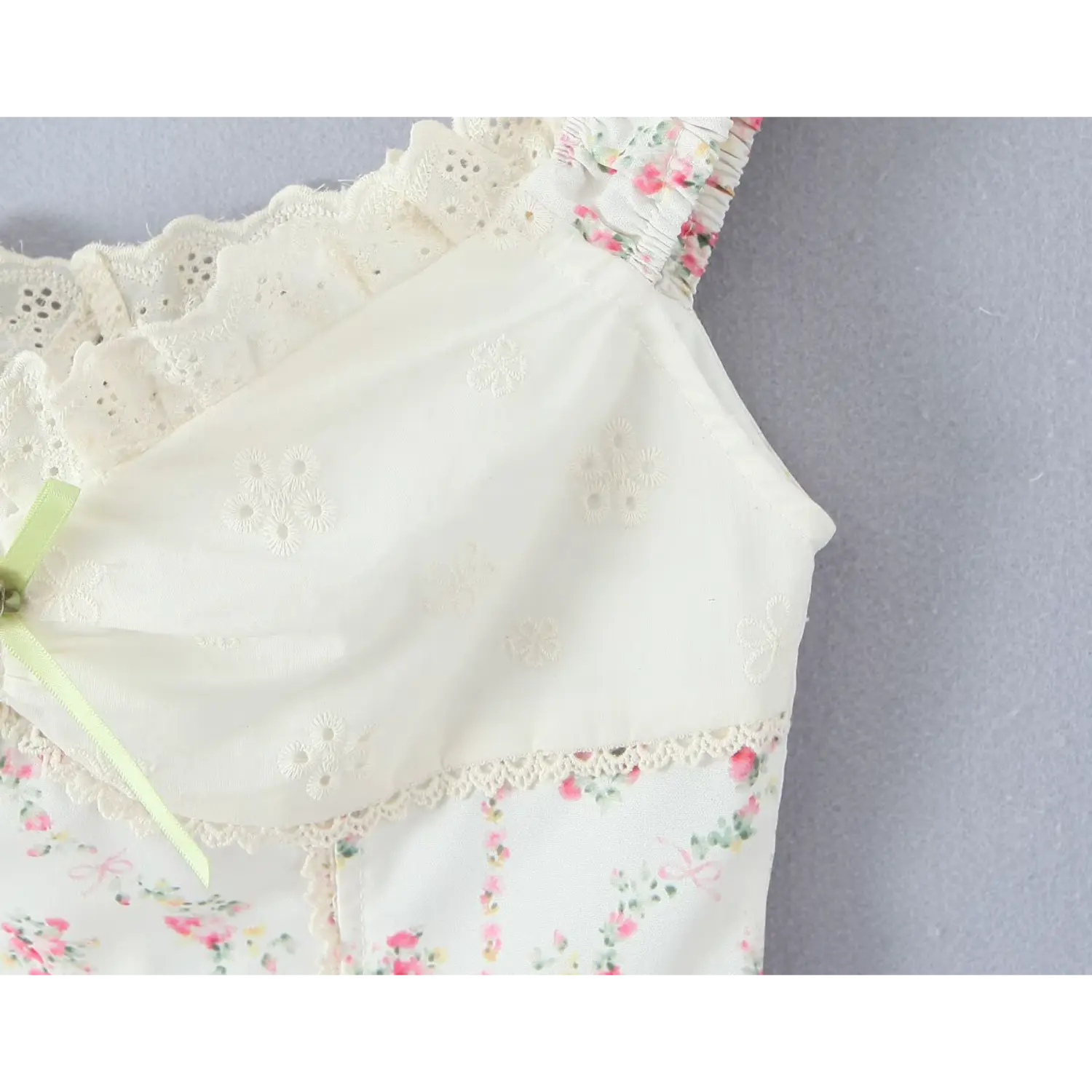 Partial bodice close‑up white floral eyelet embroidery lace seam transition vintage camisole top