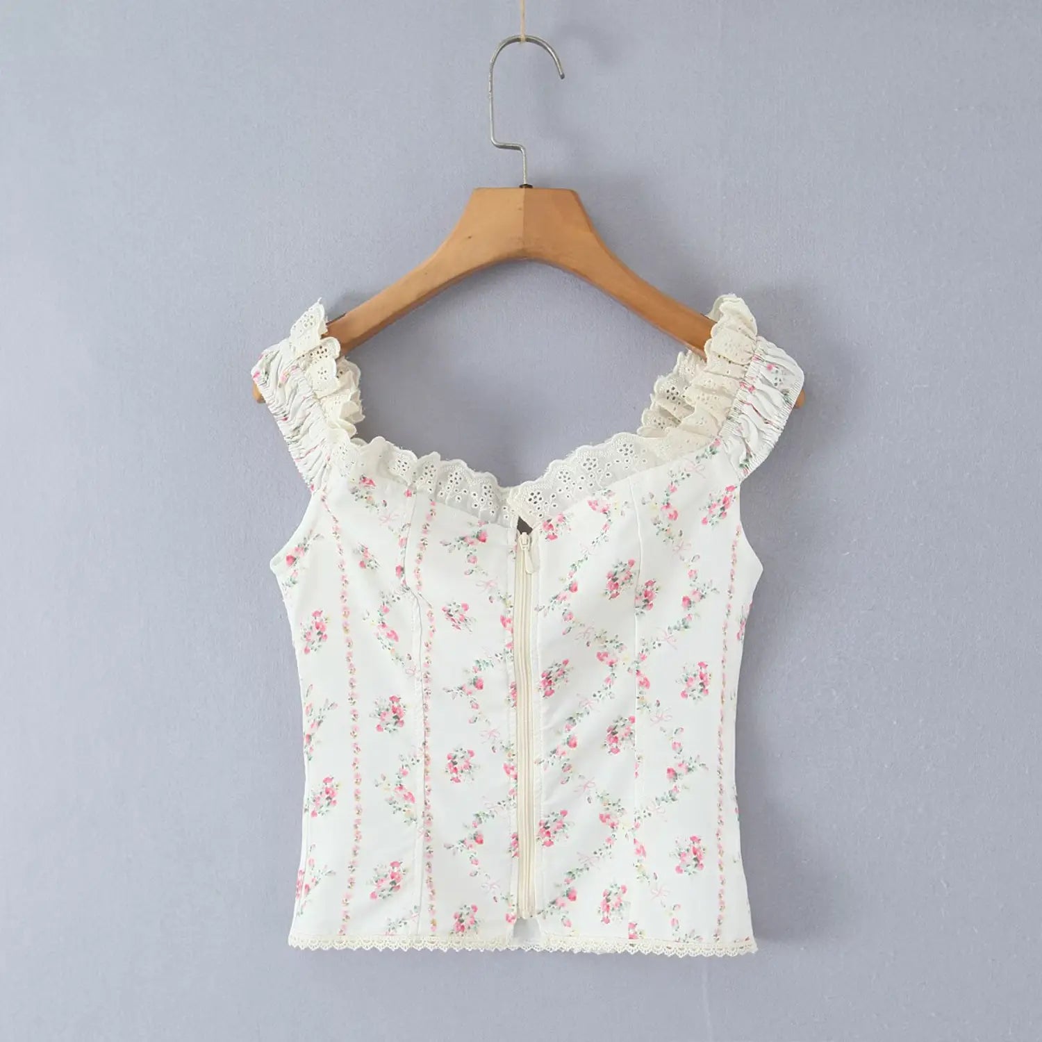 Full back hanging shot wooden hanger center back vertical zipper floral corset cami top lace ruffle neckline