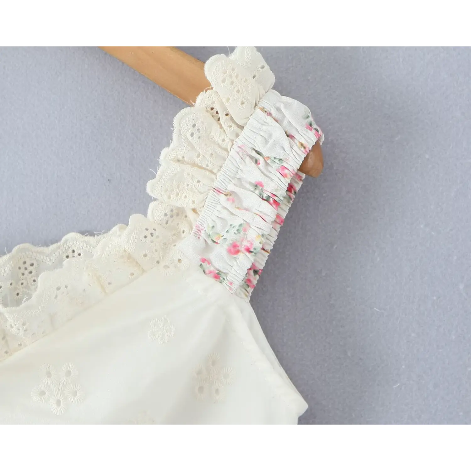 Shoulder strap close‑up smocked elastic construction layered eyelet lace ruffle trim floral cami top
