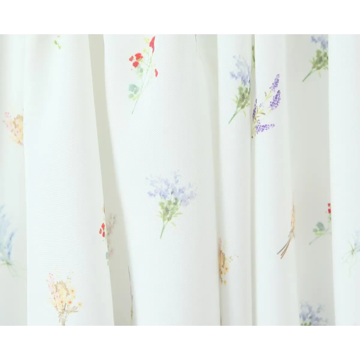 Close-up of the dress's fabric, showing the ditsy floral print and lightweight texture.
