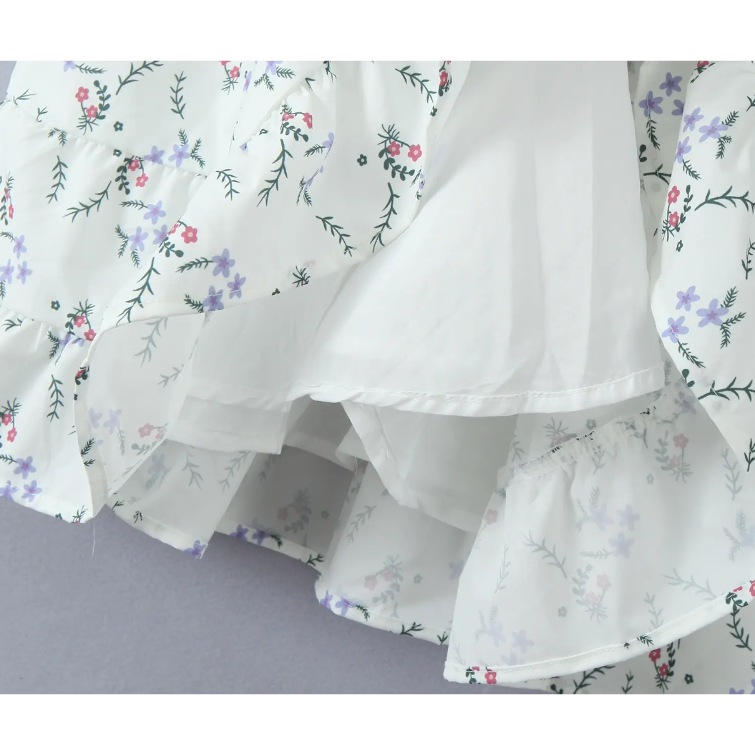Inside view showing full inner lining of floral dress, layered ruffle skirt construction detail