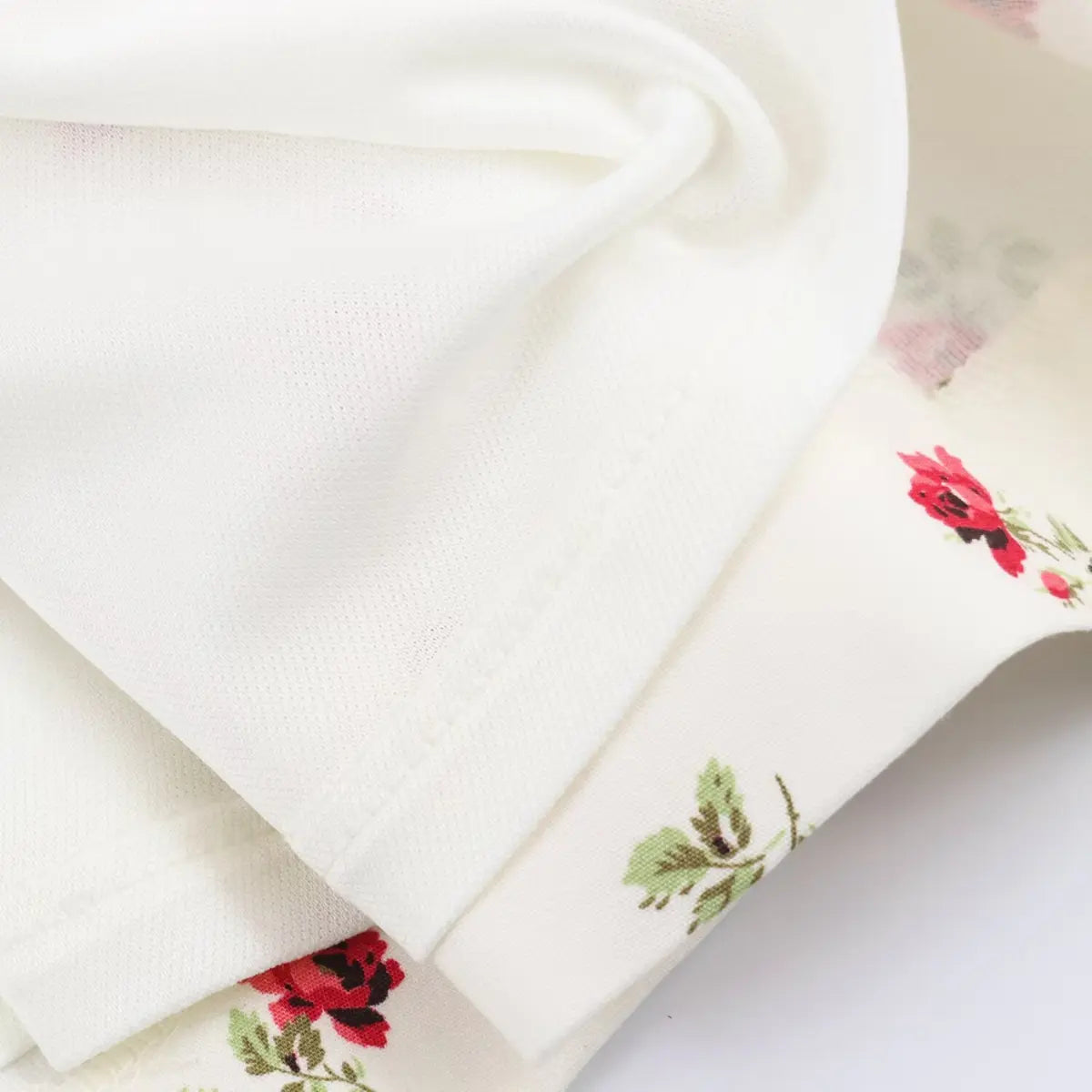 Close-up of the dress's lining and hem, showing the clean stitching and smooth fabric texture.