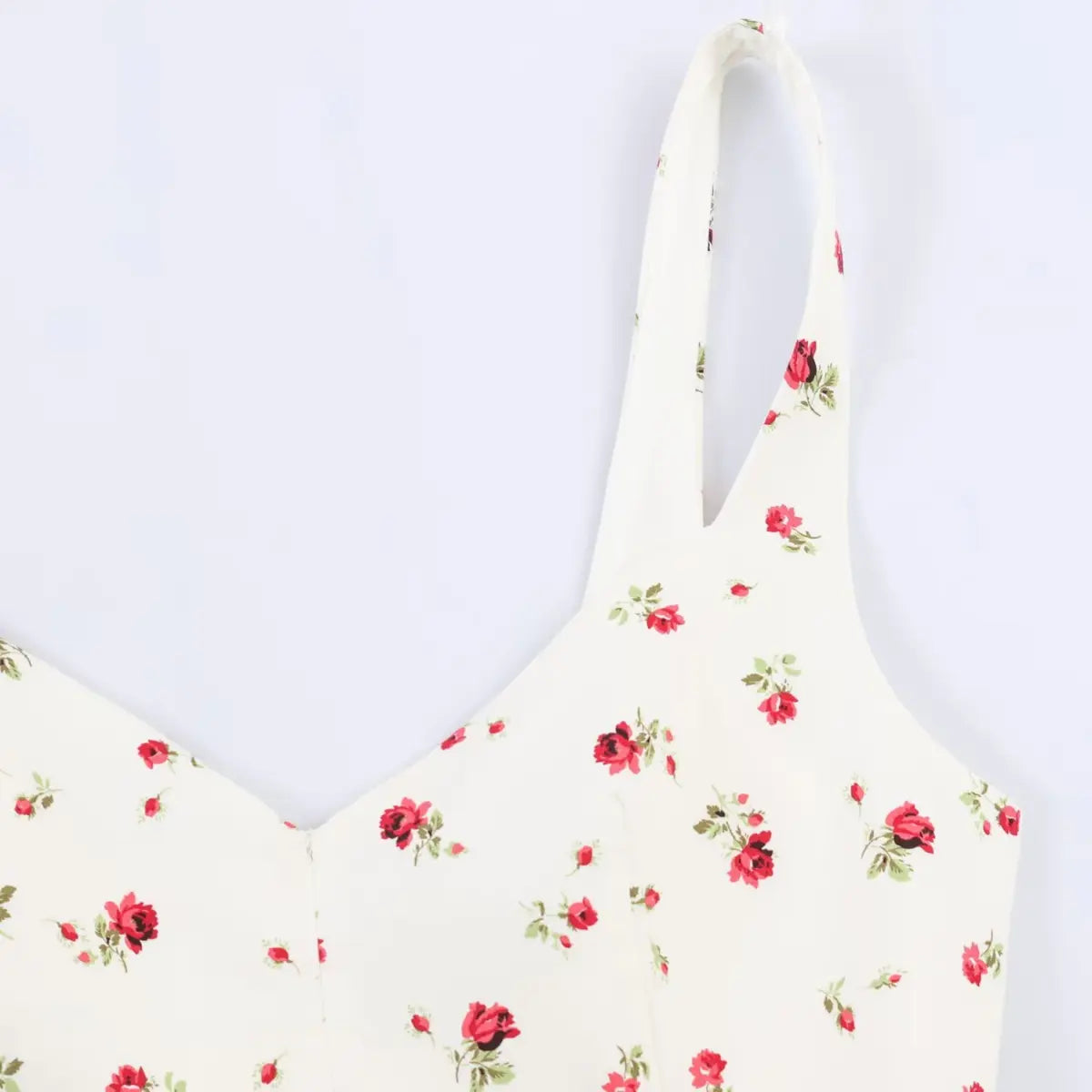 Close-up of the dress's wide spaghetti strap and sweetheart neckline.