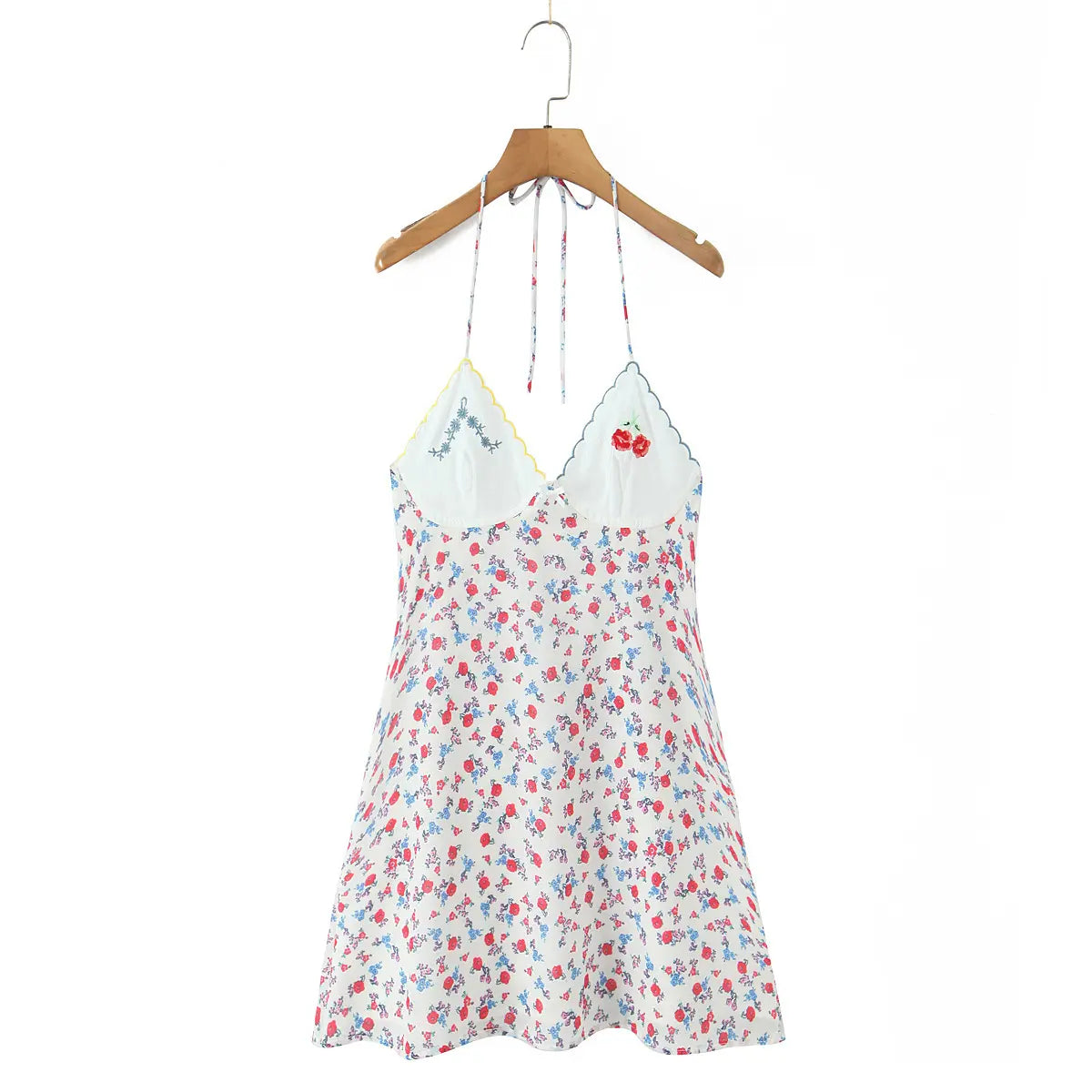 Full front view of halter neck floral print mini slip dress with embroidered cups, on wooden hanger