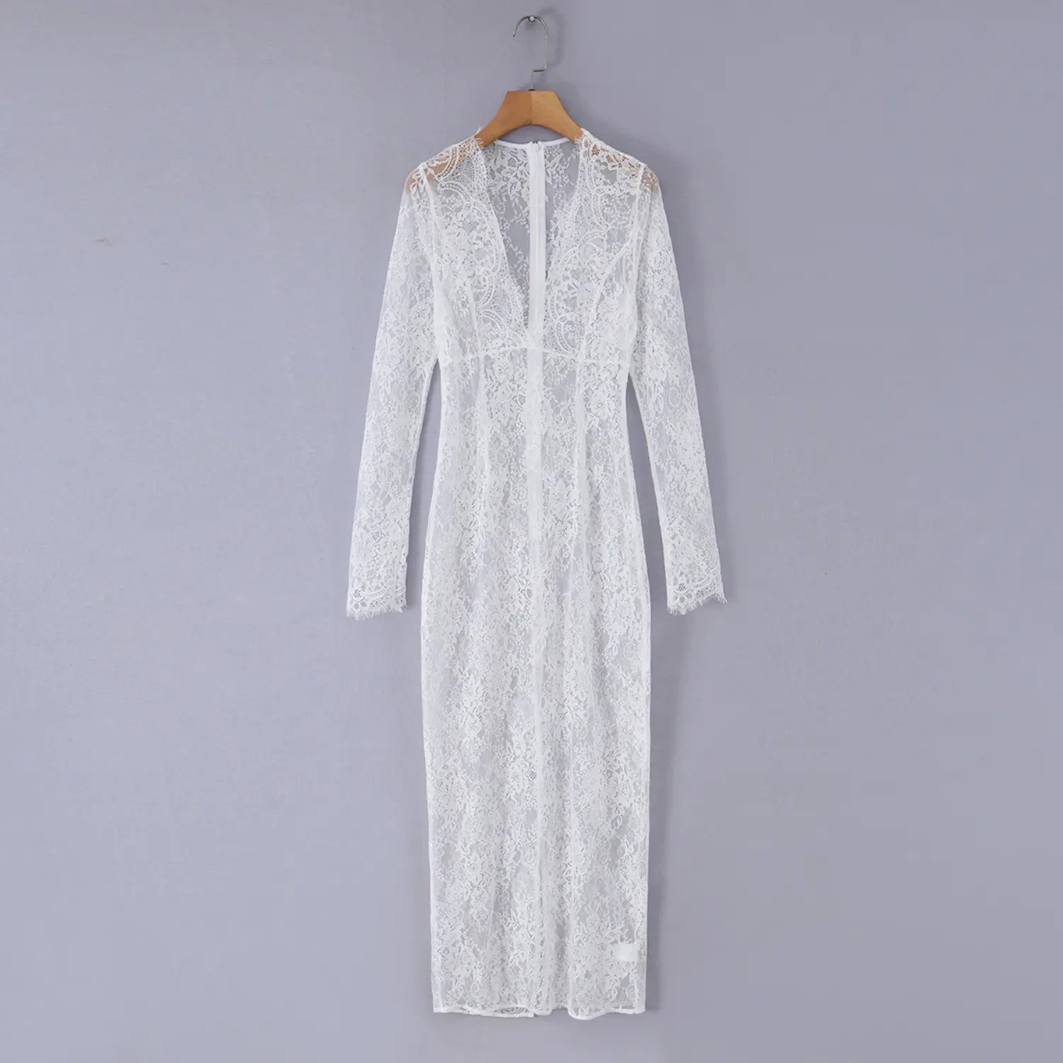 Hanger shot of sheer white floral lace long sleeve maxi dress, deep v‑neck, full floor‑length lace maxi skirt