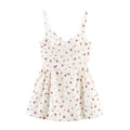 Front view of a white spaghetti strap dress with red rose print, sweetheart neckline, and gathered A-line skirt.