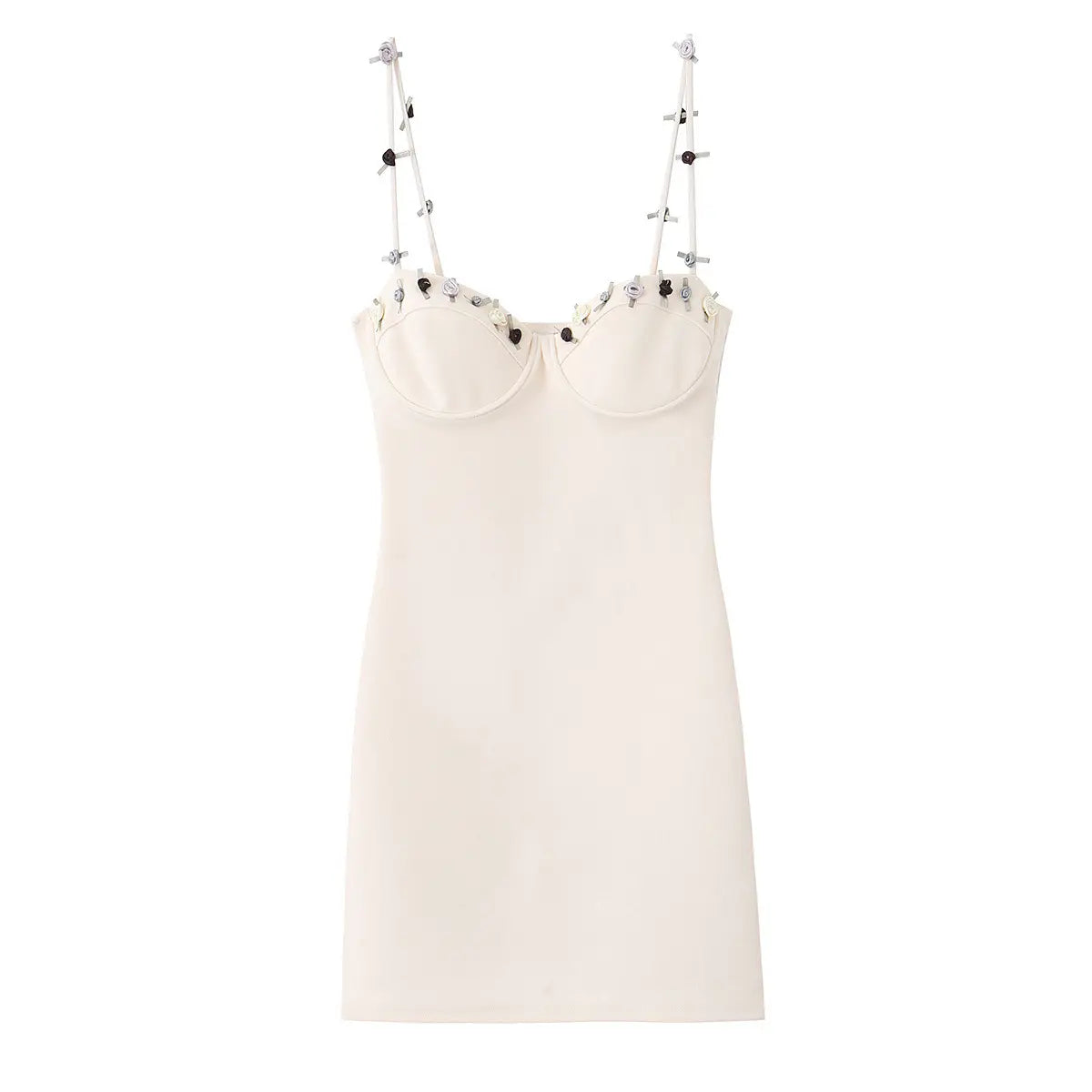 Front view of the white corset-style mini dress, showcasing bust cups, decorative floral accents, and thin straps.