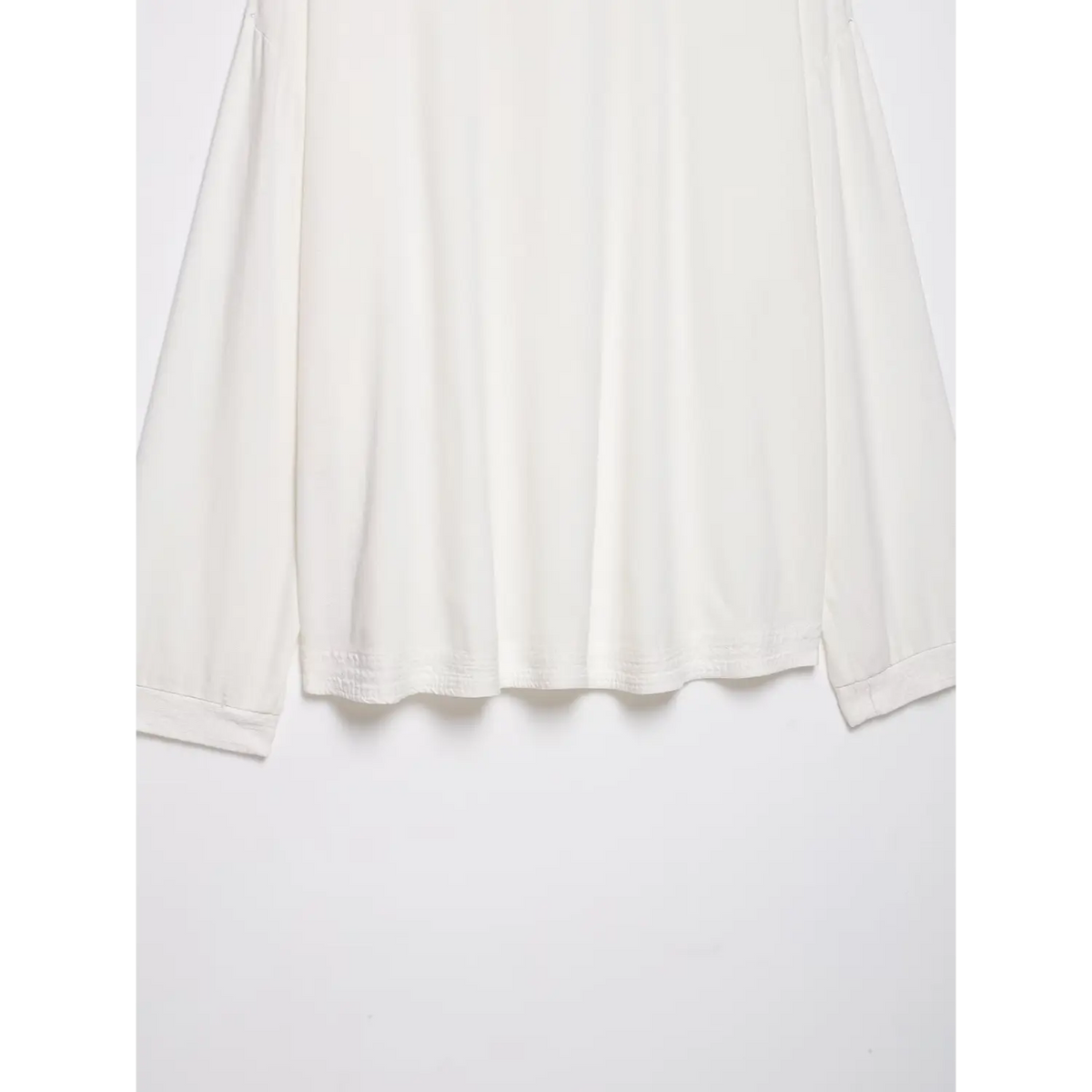 Close-up of shirred hem and folded cuffs