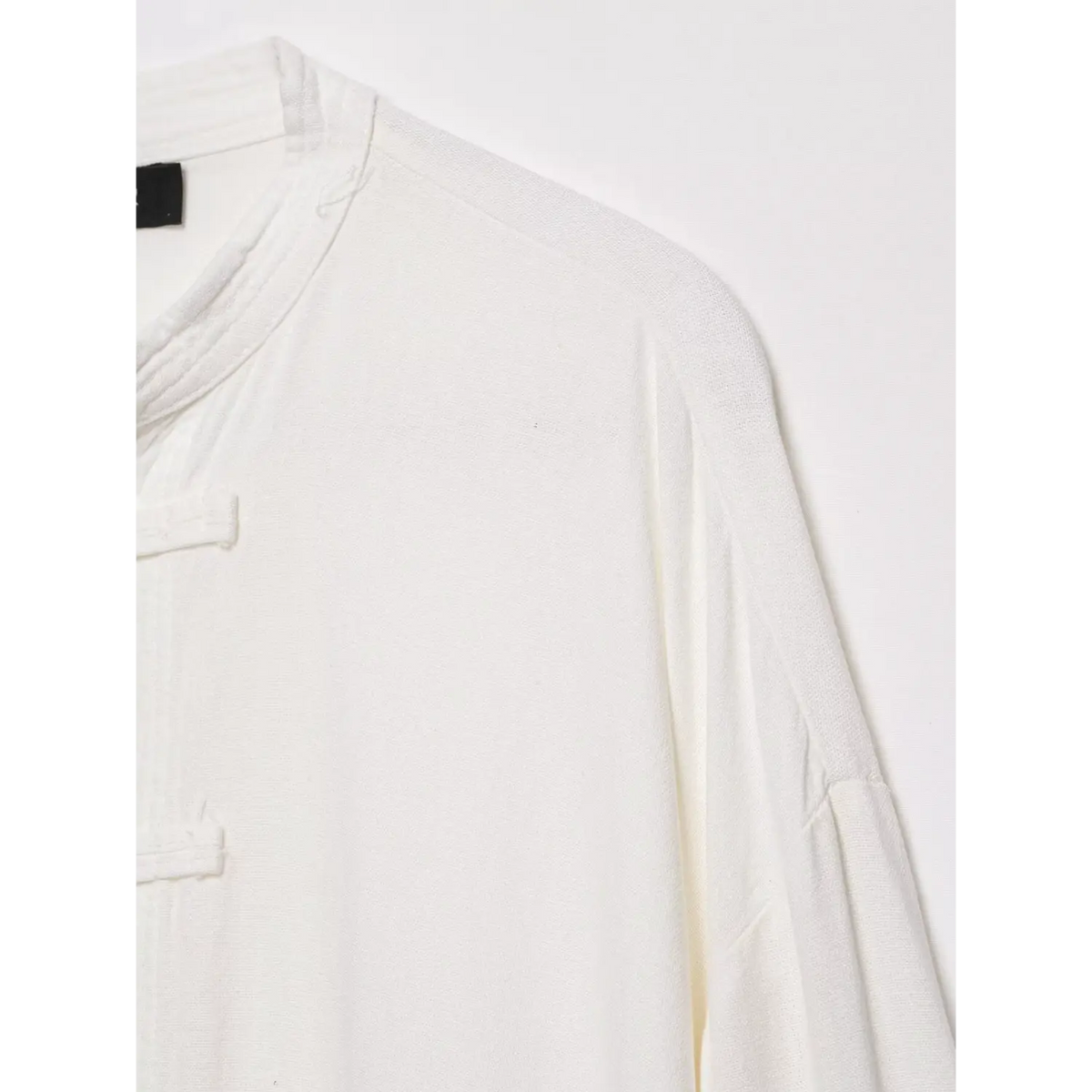 Close-up of stand collar and drop shoulder seam