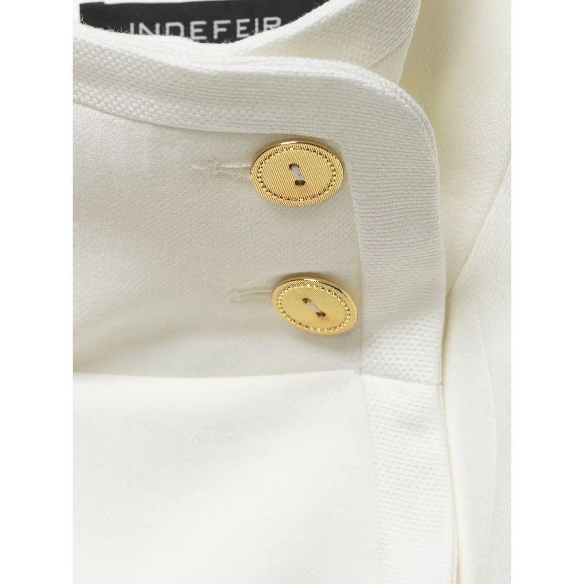 Close-up of collar gold buttons