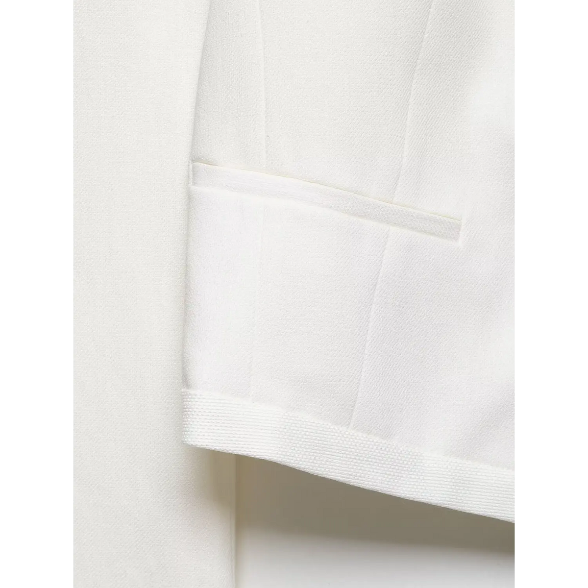 Close-up of welt pocket flap and hem stitching
