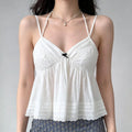 Female model wearing white halter cami top, casual sweet summer outfit, peplum silhouette